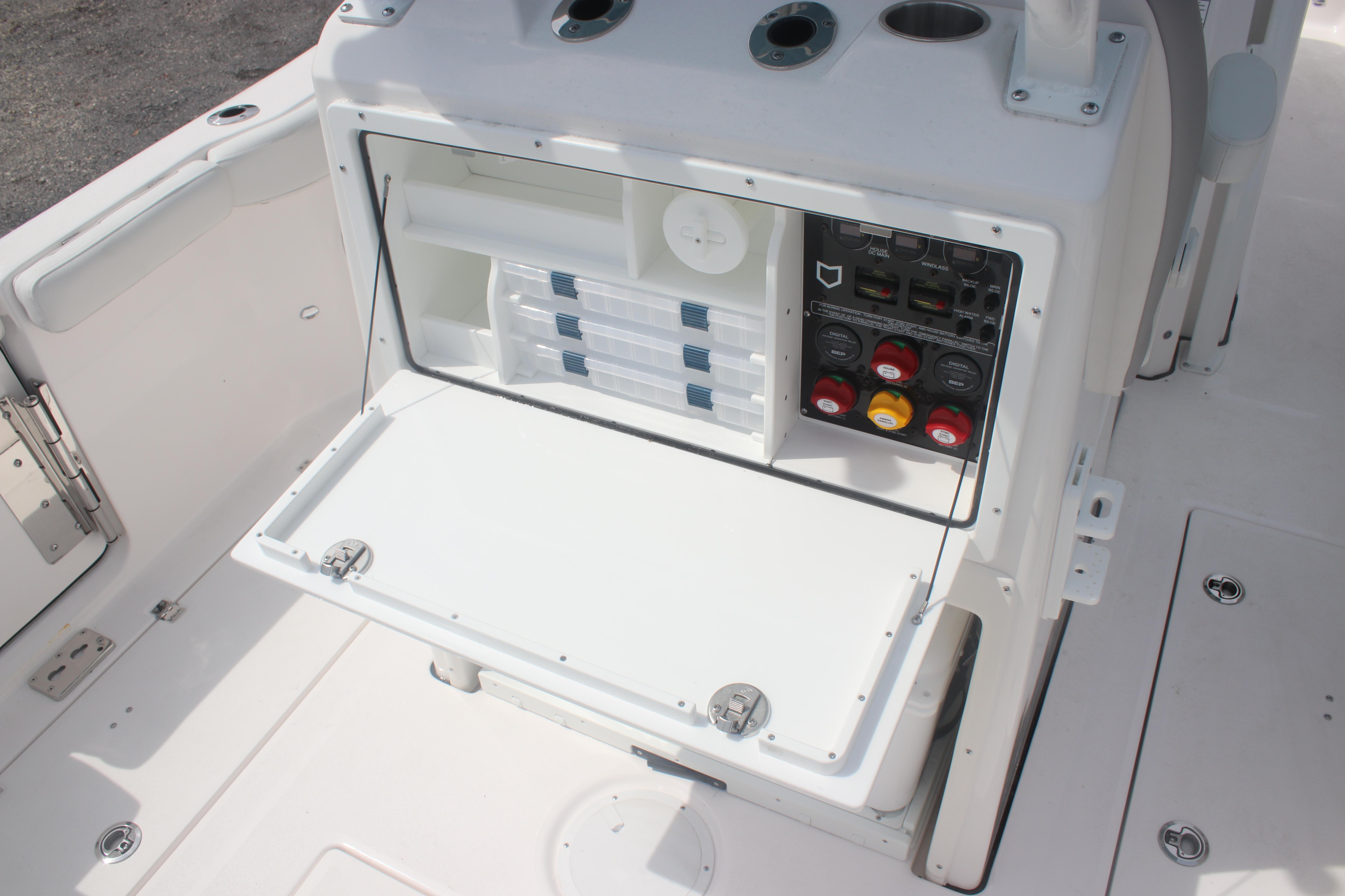 2026 Sea Fox 288 Commander boat console with storage and control panel.