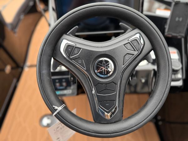 Steering wheel of 2025 Yamaha Boats 255XD, featuring modern design and controls.