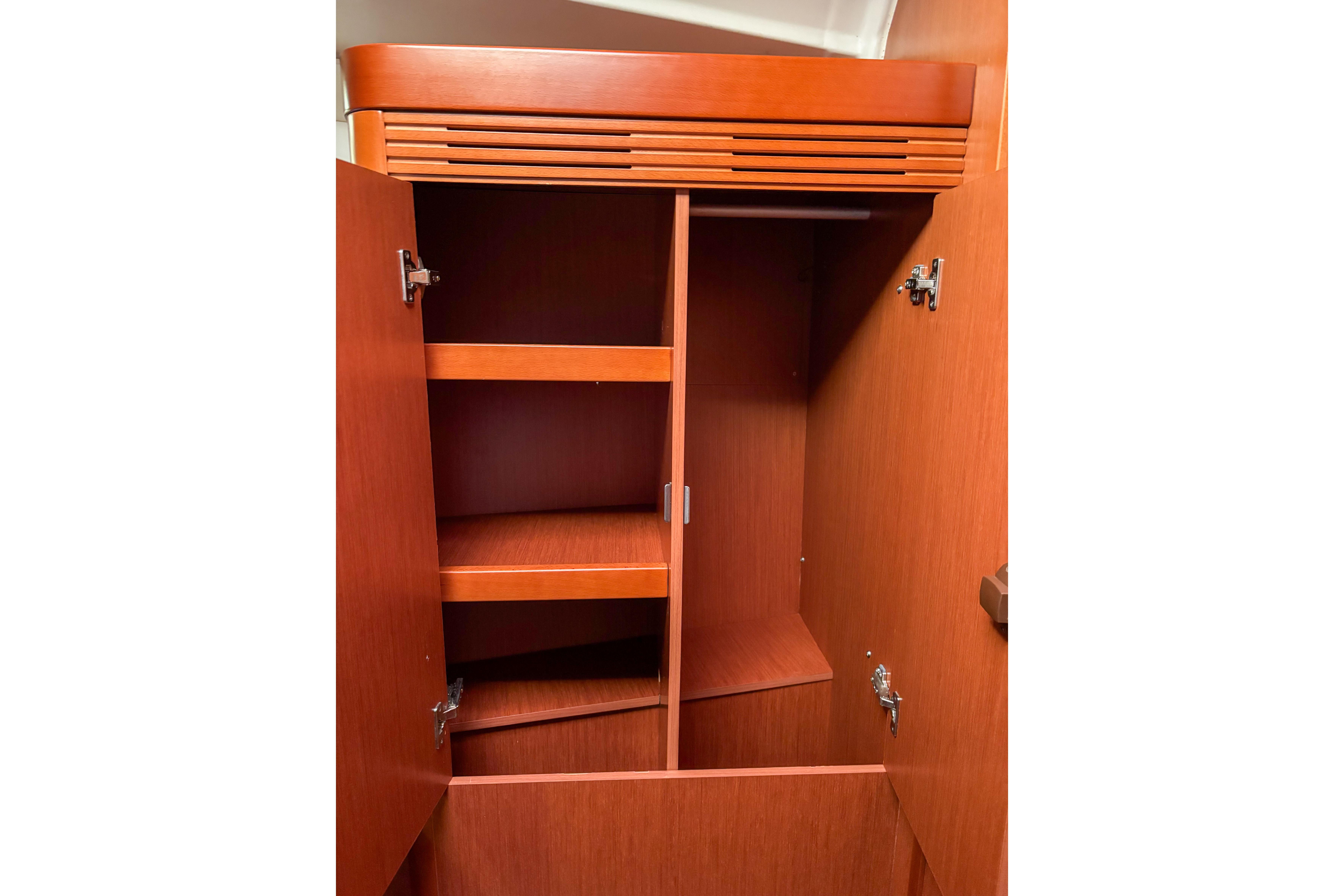 Wooden cabinet interior on a 2015 Beneteau Oceanis 37 sailboat.