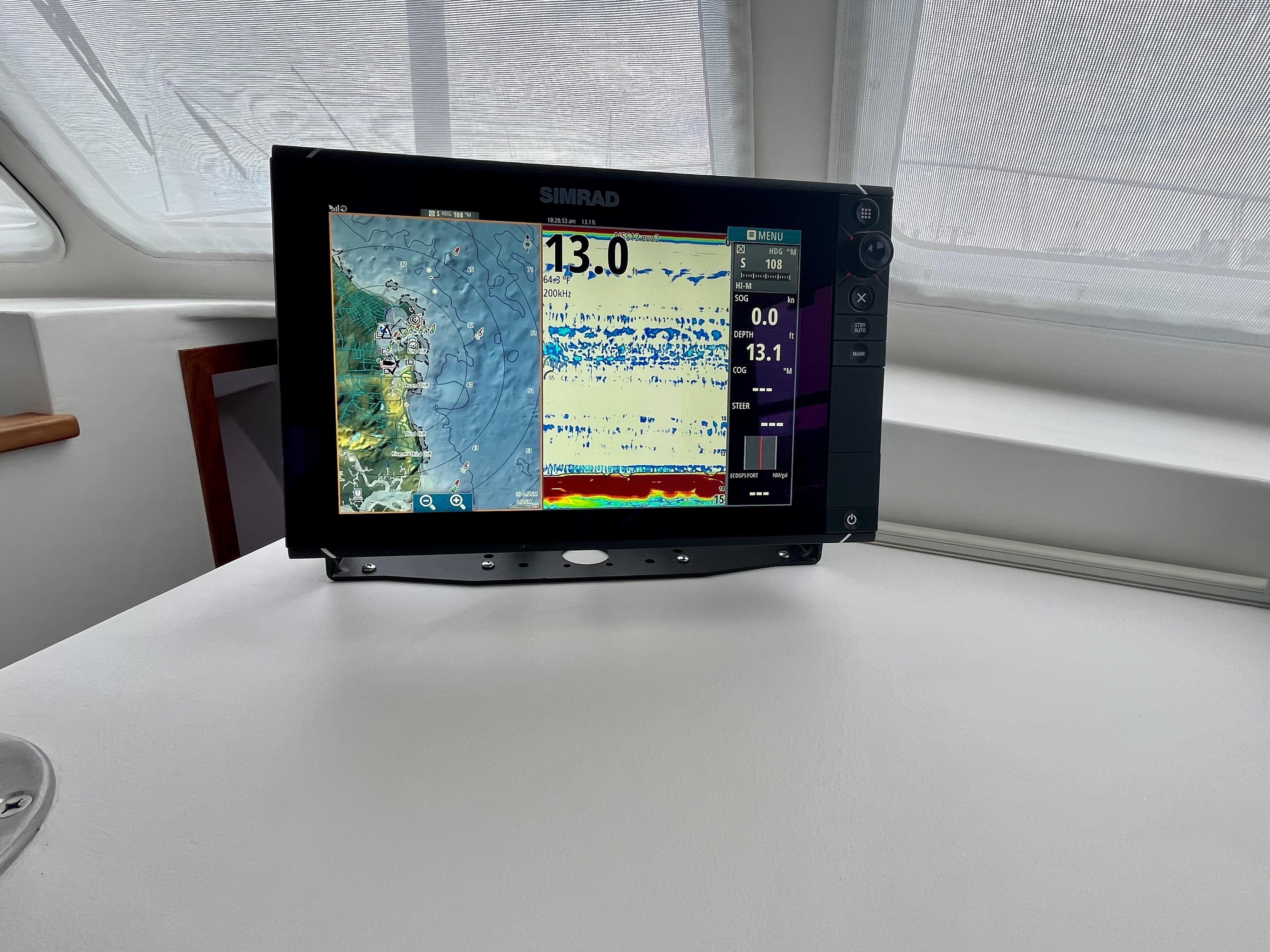 Simrad marine display on 2016 Wesmac 42 boat, showing navigation and sonar data.