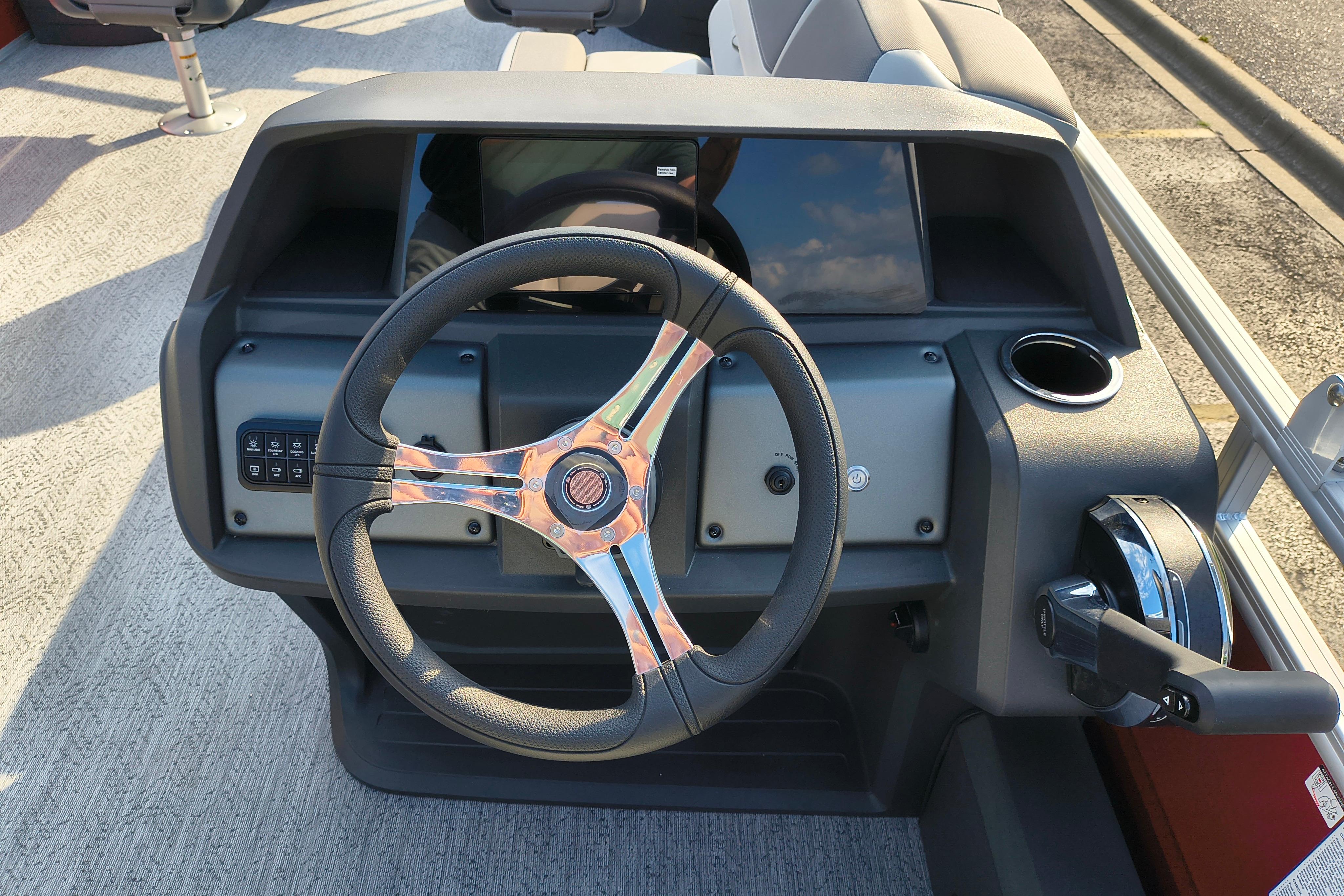 Steering console of 2026 Sun Tracker Fishin' Barge 22 DLX pontoon boat.