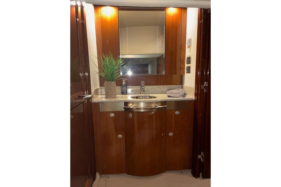 Luxurious bathroom interior of 2008 Sea Ray 48 Sundancer yacht with elegant wood finish.