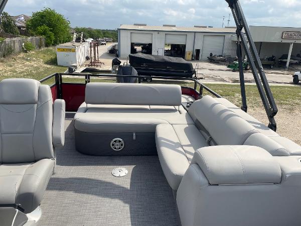2023 Regency 250DL3 pontoon boat with spacious seating and modern design.