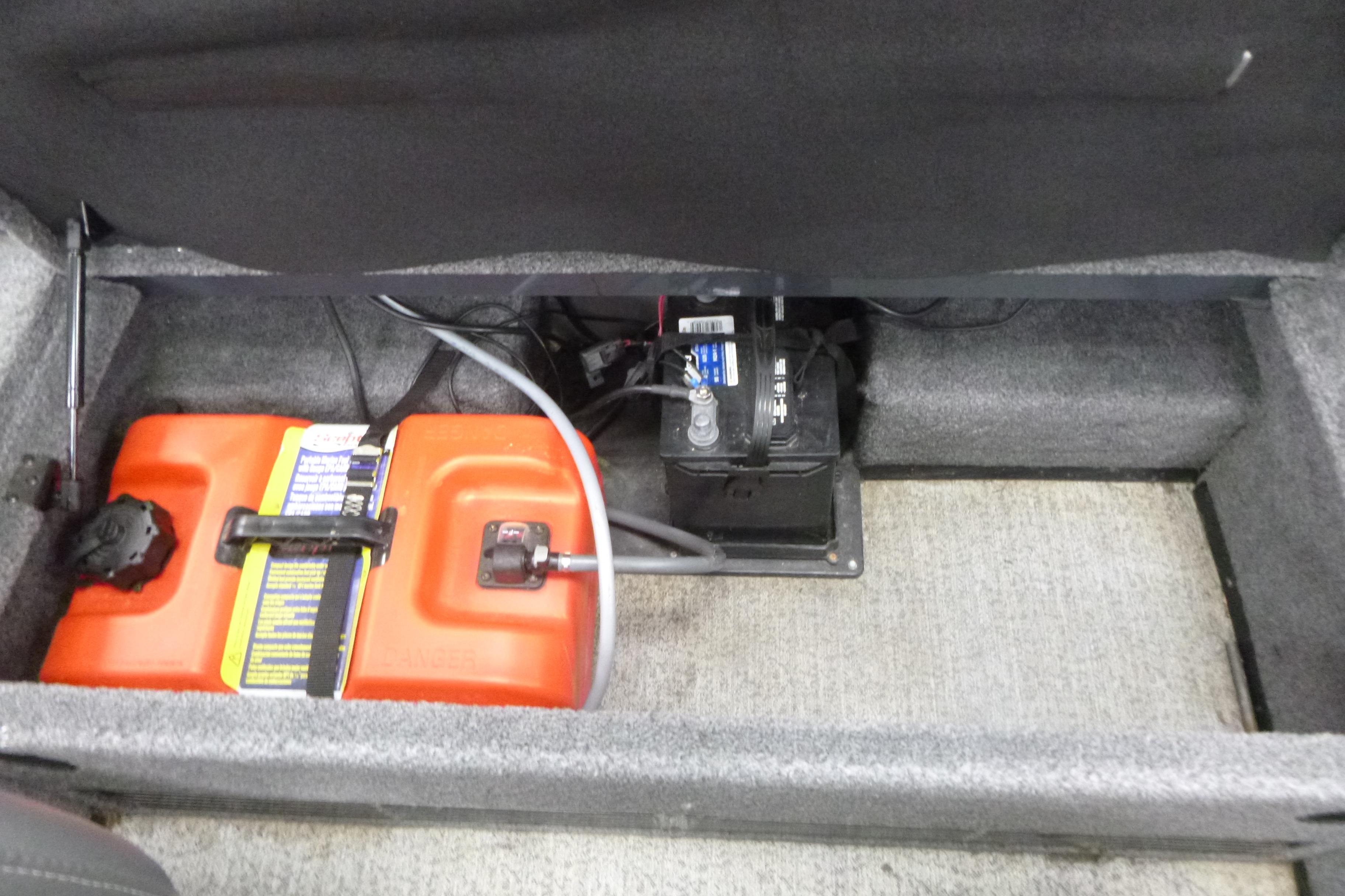 2021 Ranger VS1660 T storage compartment with battery and orange fuel tank.