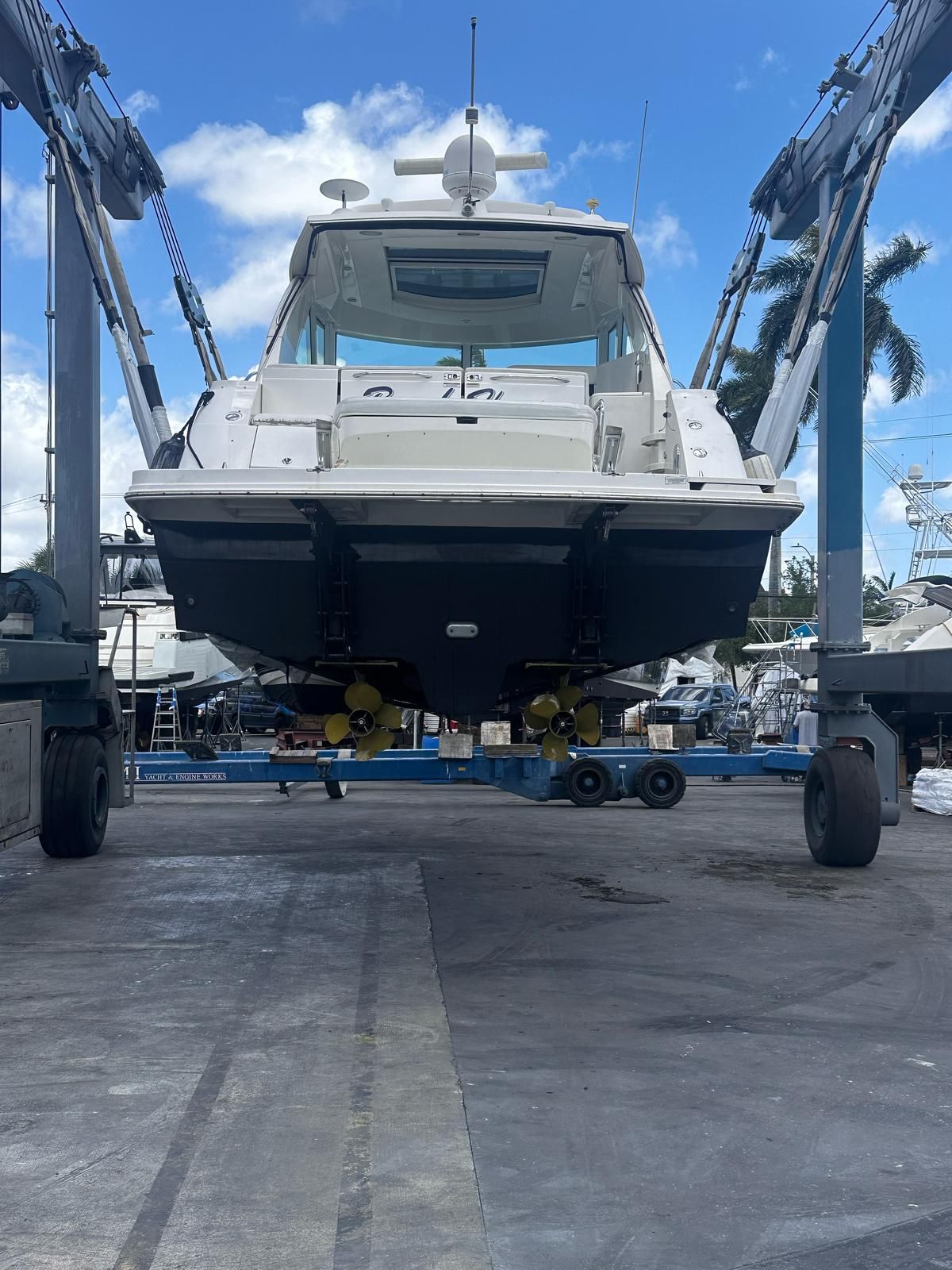 2010 Sea Ray 450 boat lifted in shipyard.