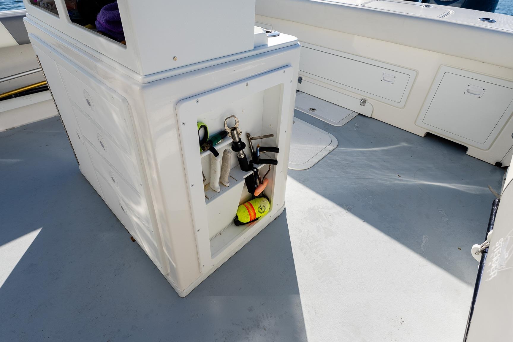 2024 Steiger Craft 31 Fisherman boat deck with storage and fishing gear.