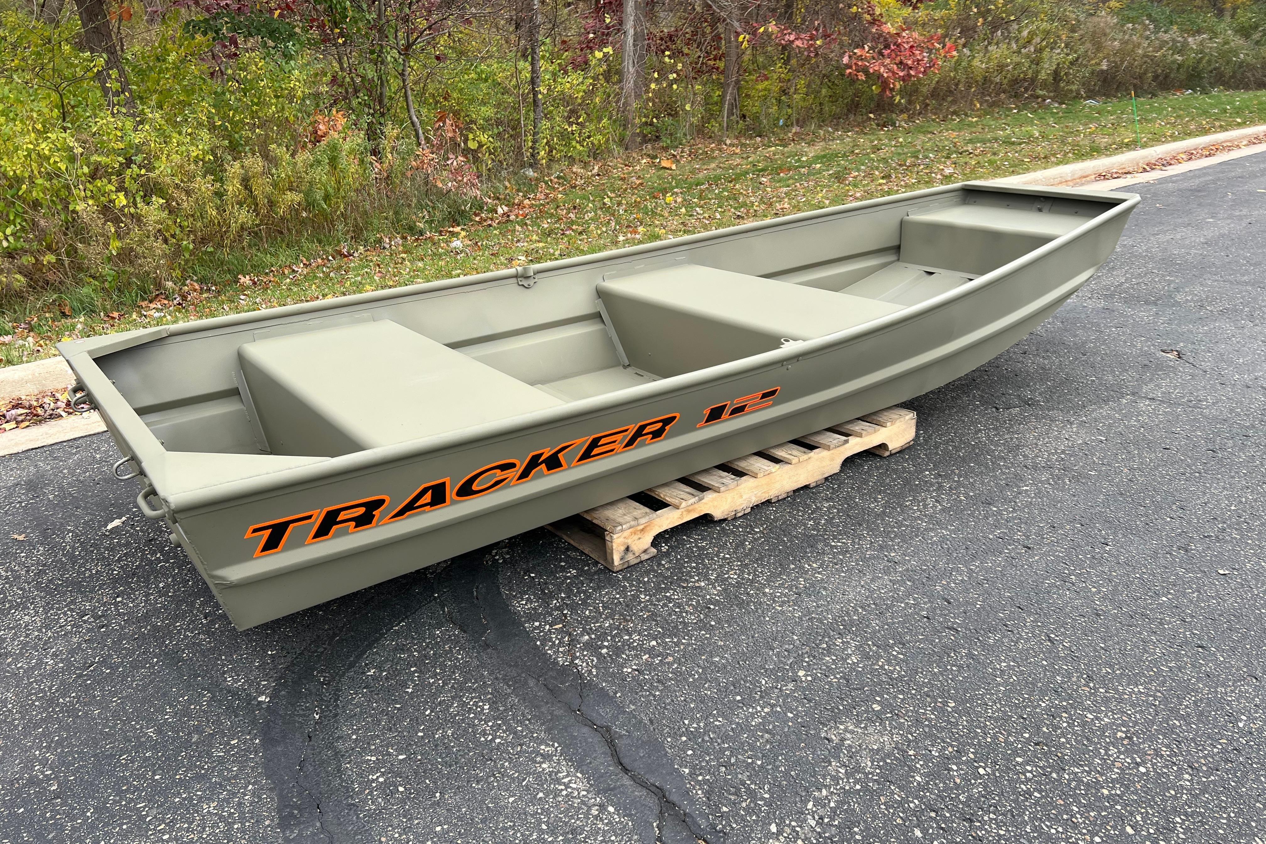 2026 Tracker Grizzly 12 Jon boat on a wooden pallet, outdoors.