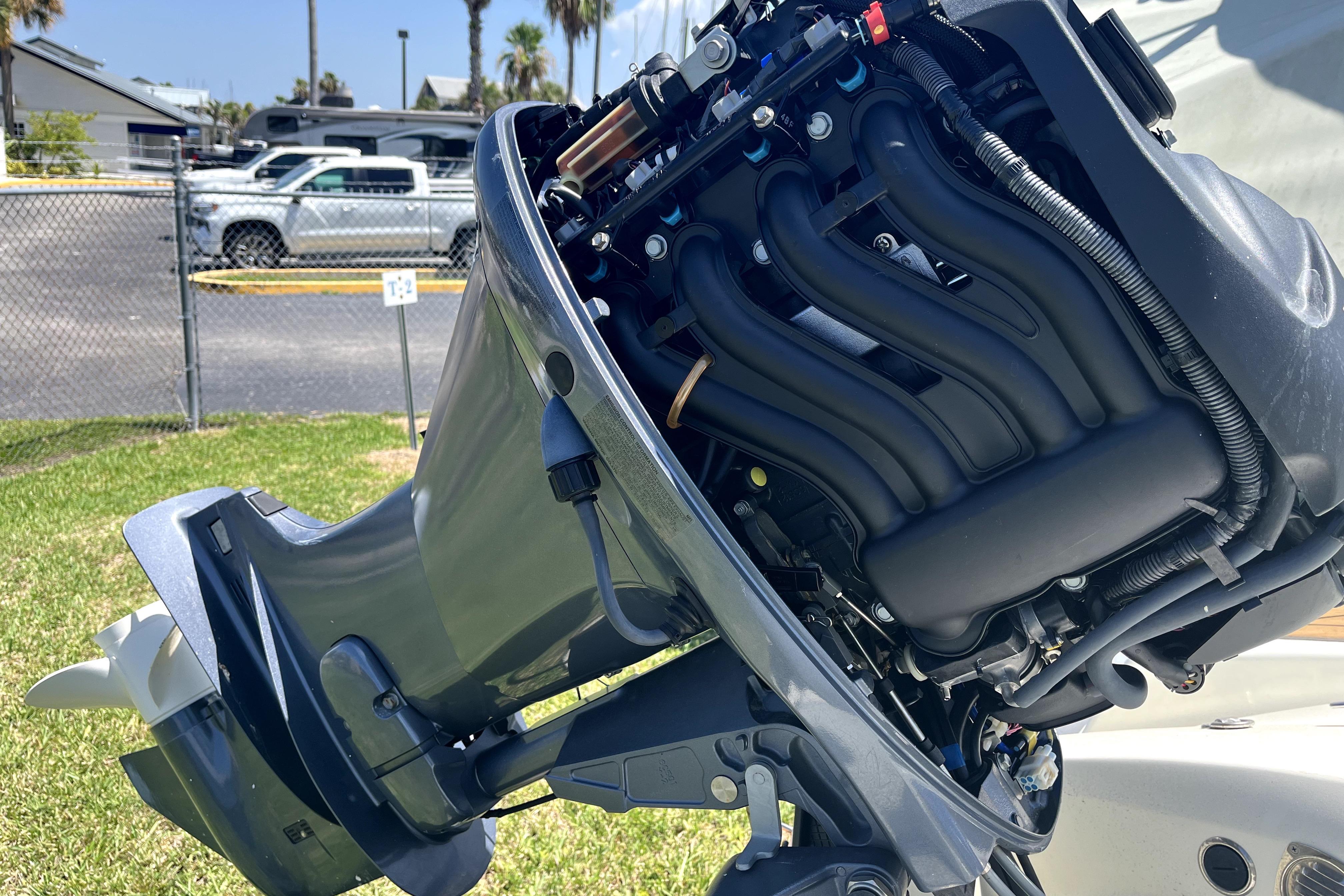 Outboard motor of a 2008 Sea Ray 60 Sundancer on display outdoors.