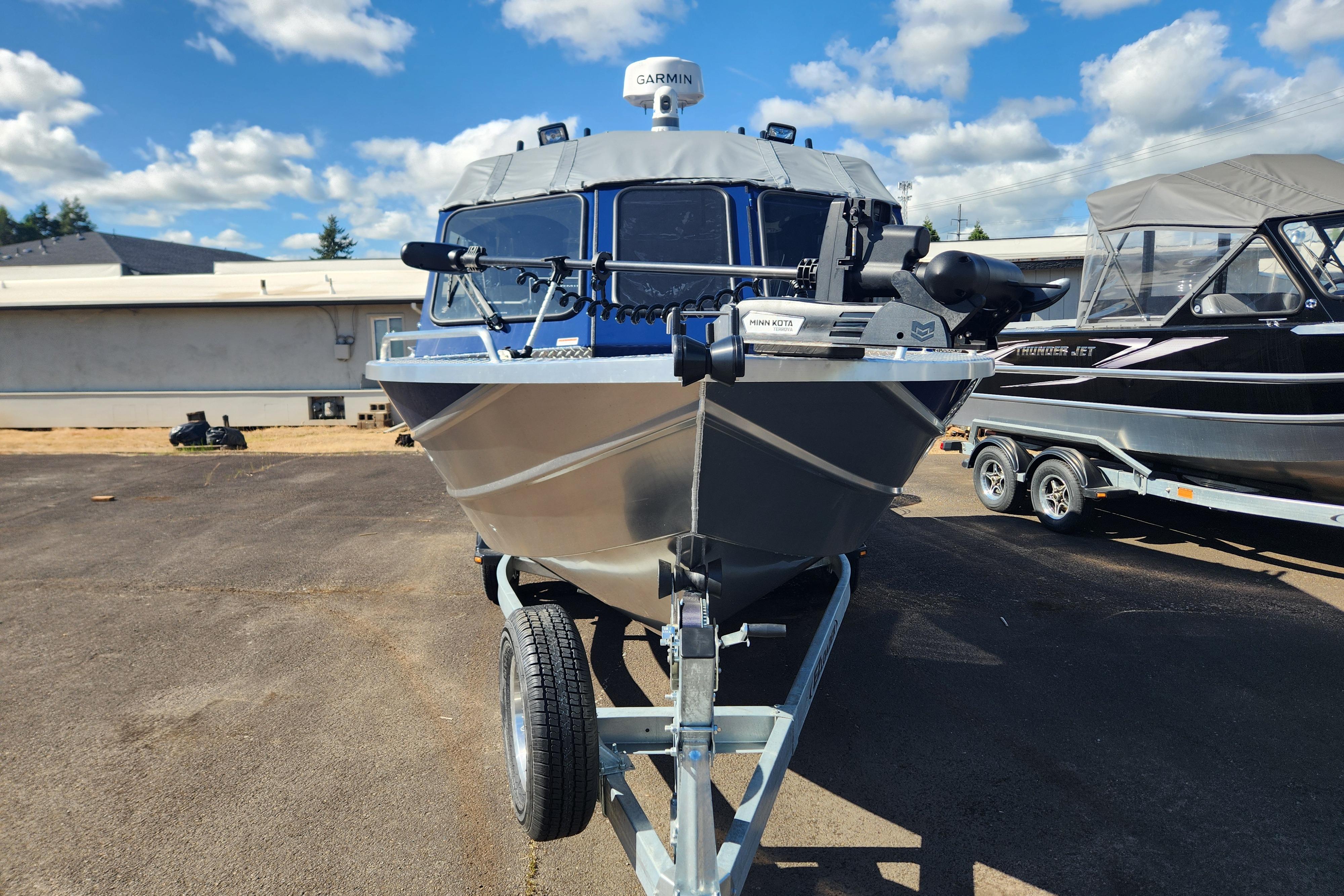 2025 Thunder Jet 21 Chinook OS boat on trailer under blue sky.