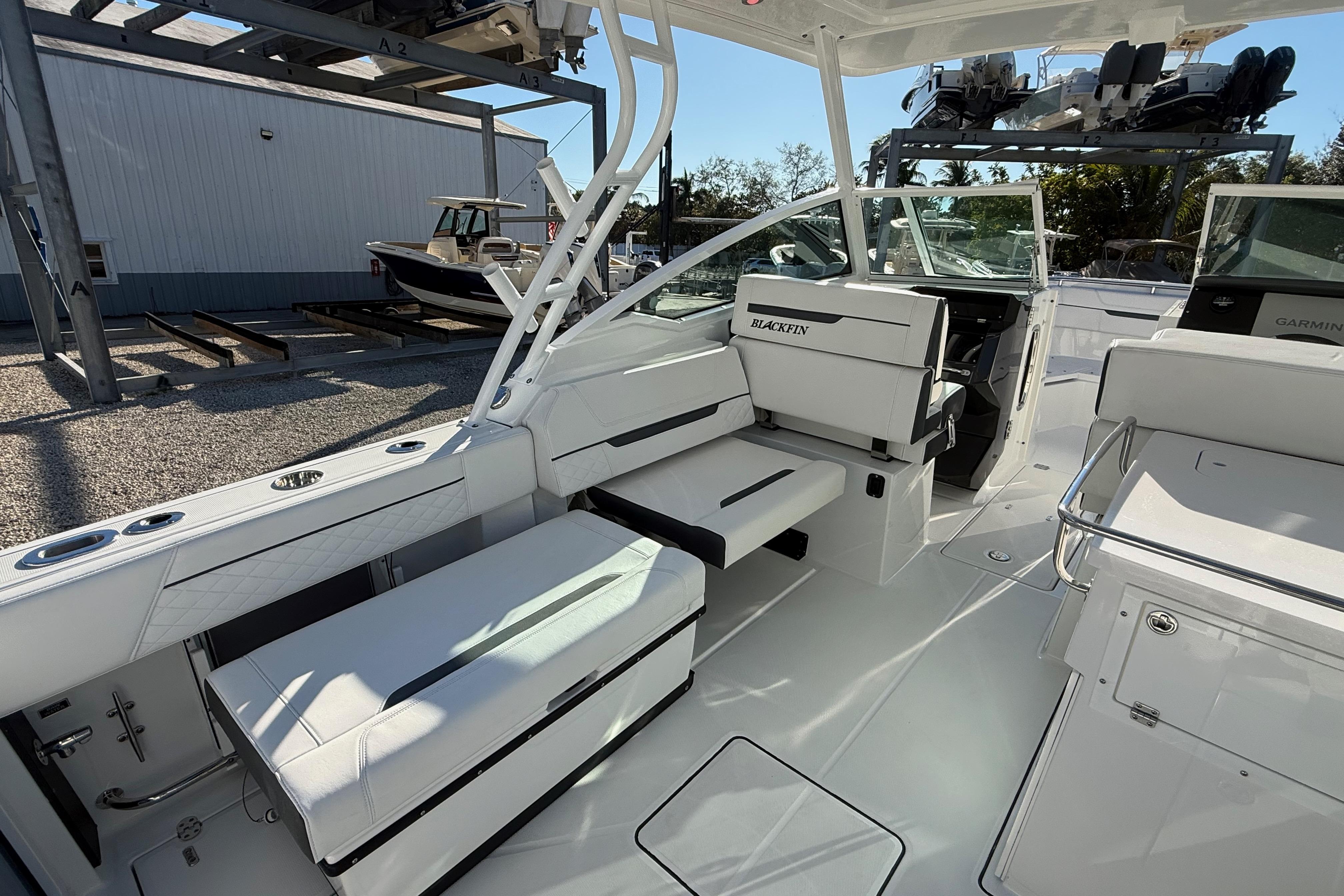 2022 Blackfin 272 DC boat interior with white seating and modern design.