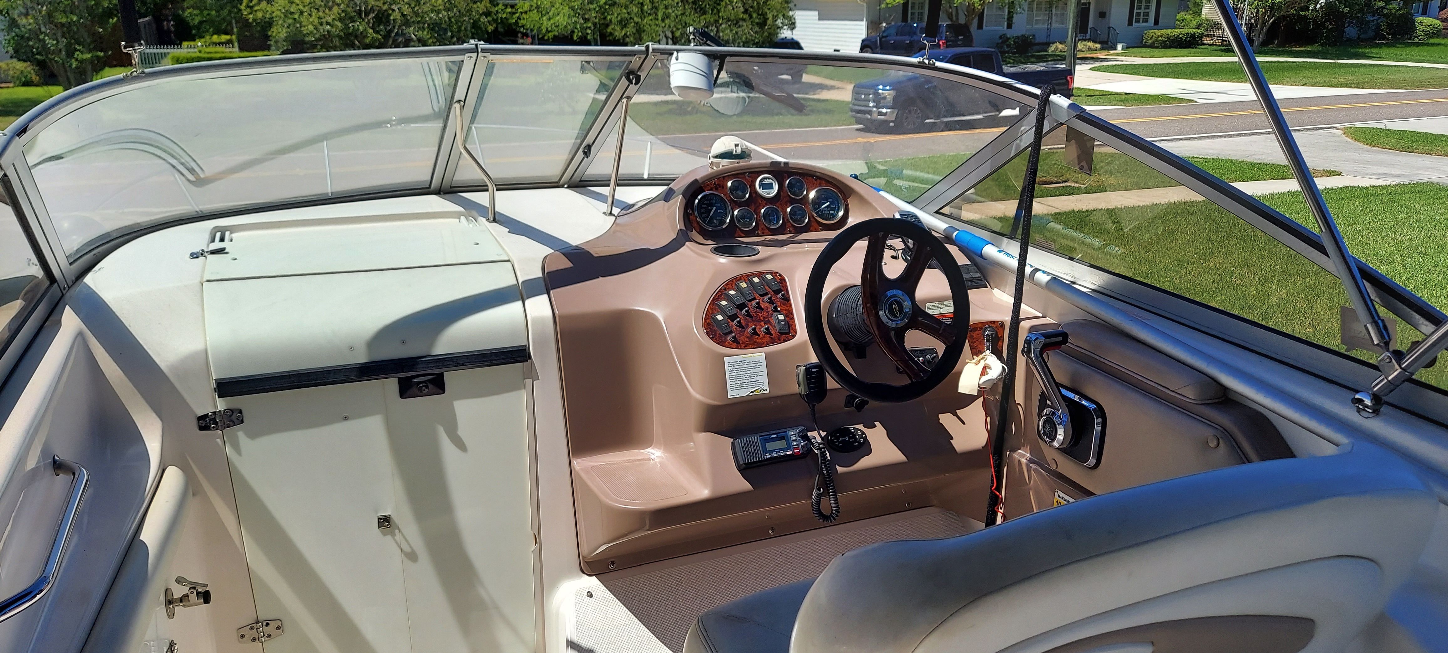 Interior of a 2004 Regal Commodore 2465 boat with steering console.