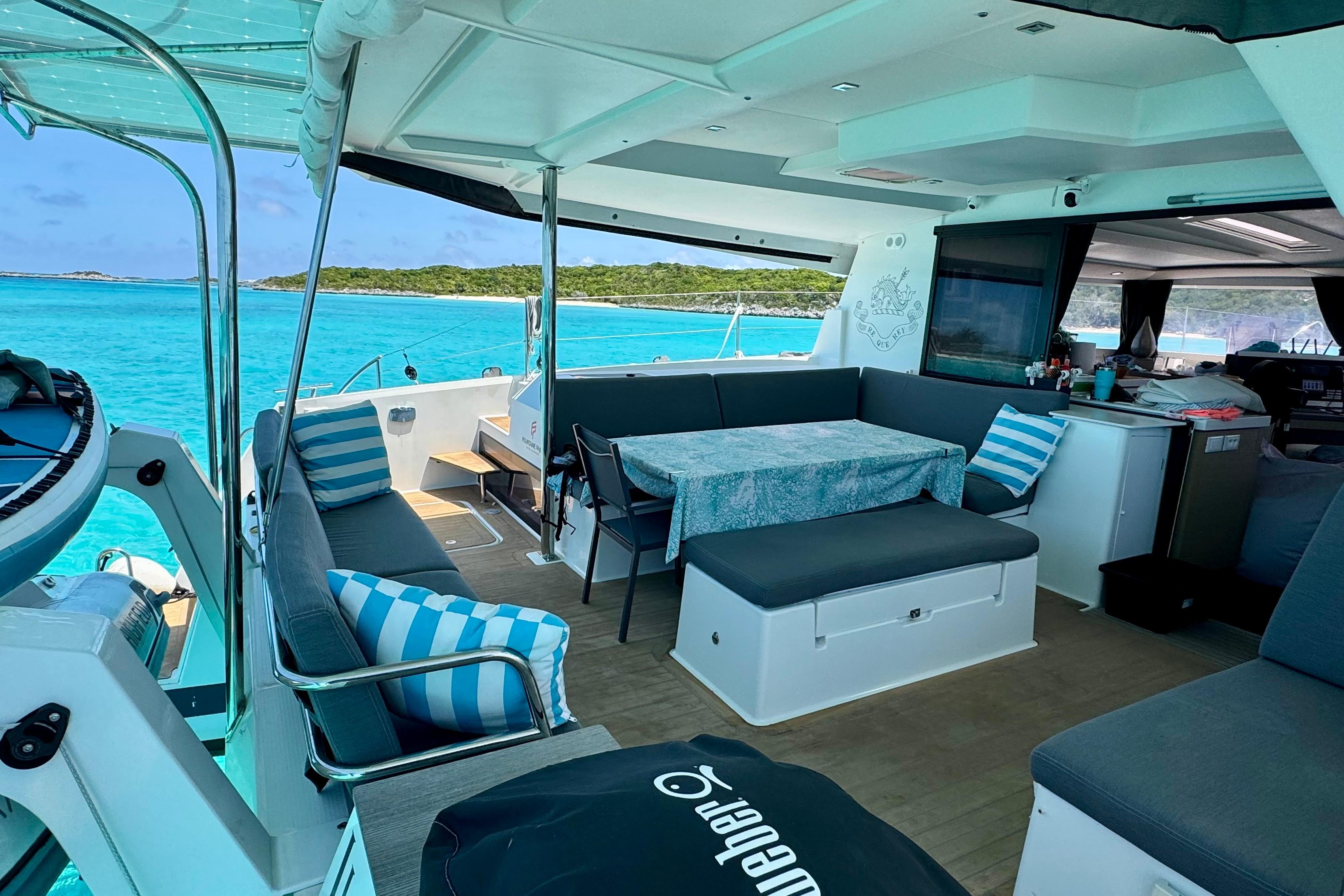 Luxurious 2020 Fountaine Pajot Saona 47 catamaran interior with ocean view and comfortable seating.