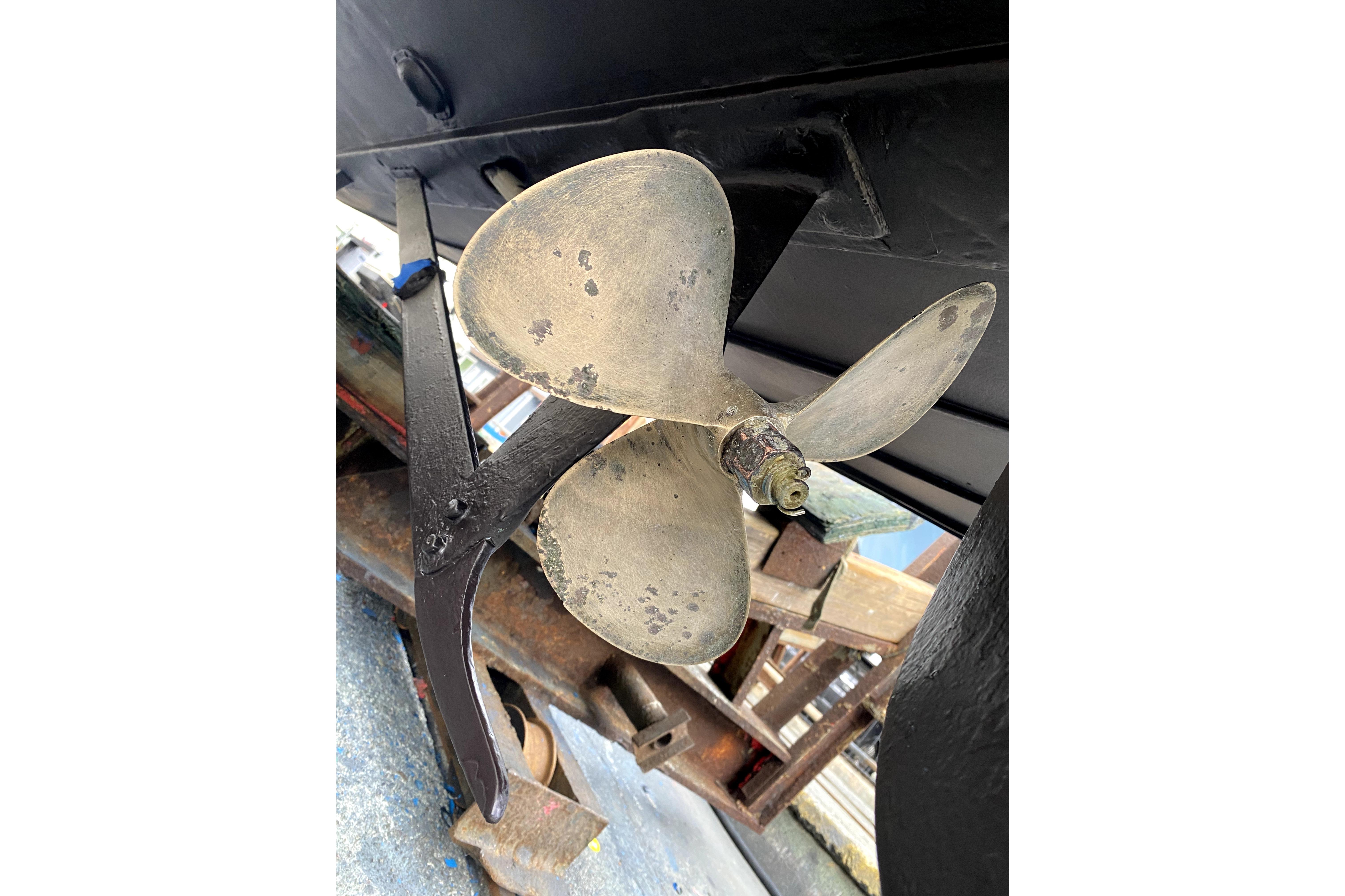 Propeller of a 1964 Lyman 25 Sleeper boat, showing wear and patina.