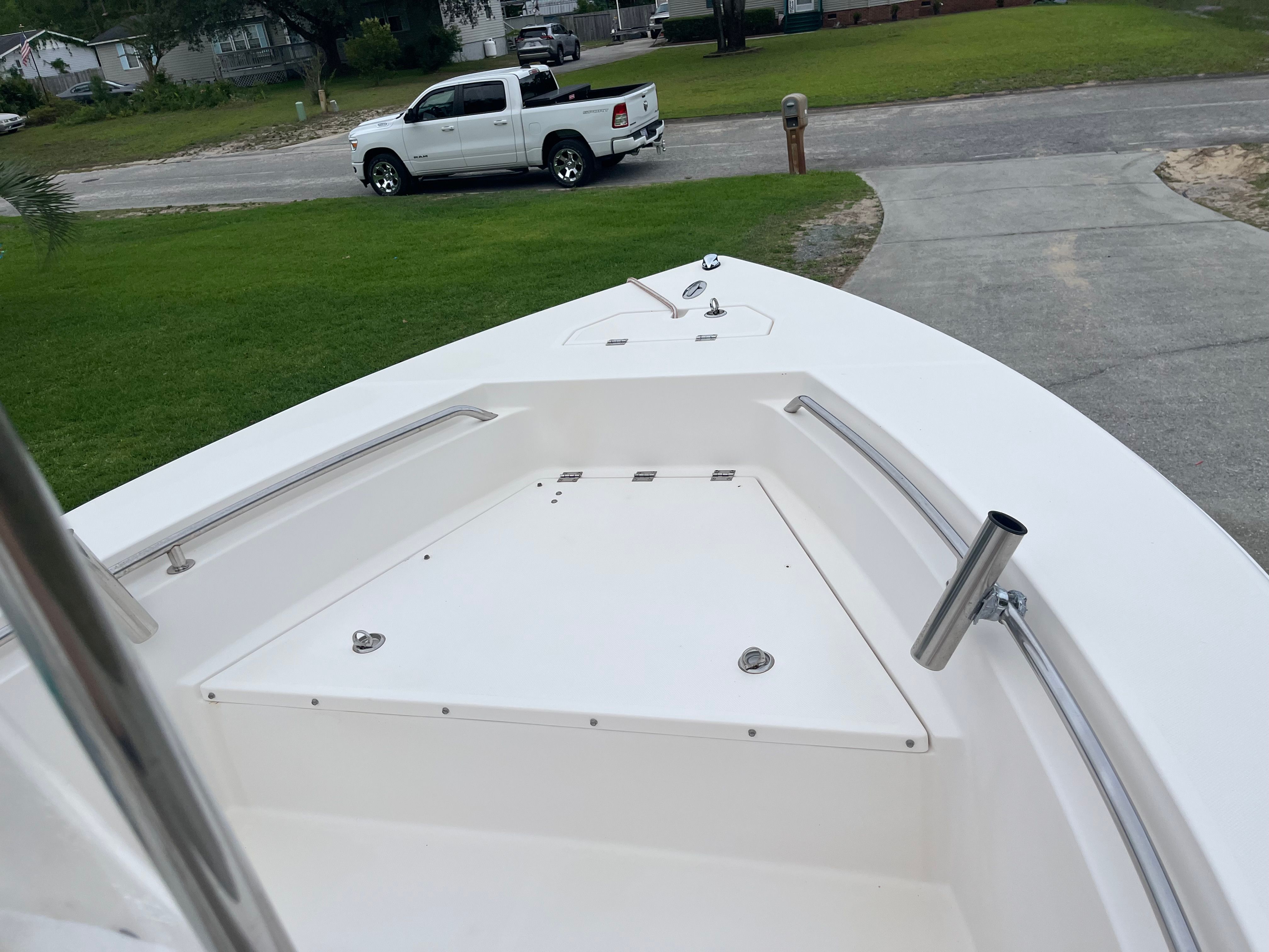 A McKee Craft Marathon 184 CC boat is on a trailer in a driveway.