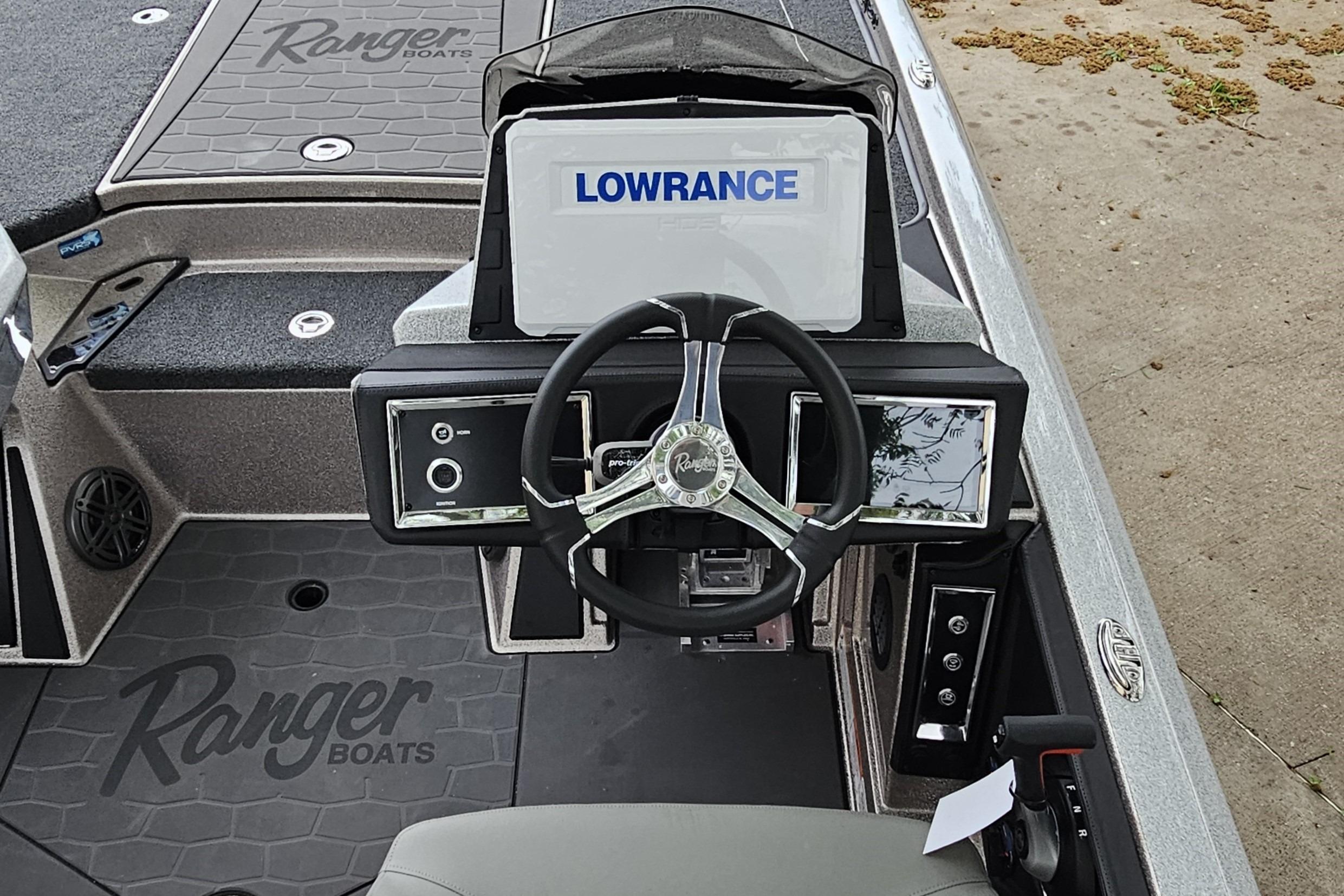 2026 Ranger Z521R Cup-Equipped boat dashboard with Lowrance display and steering wheel.