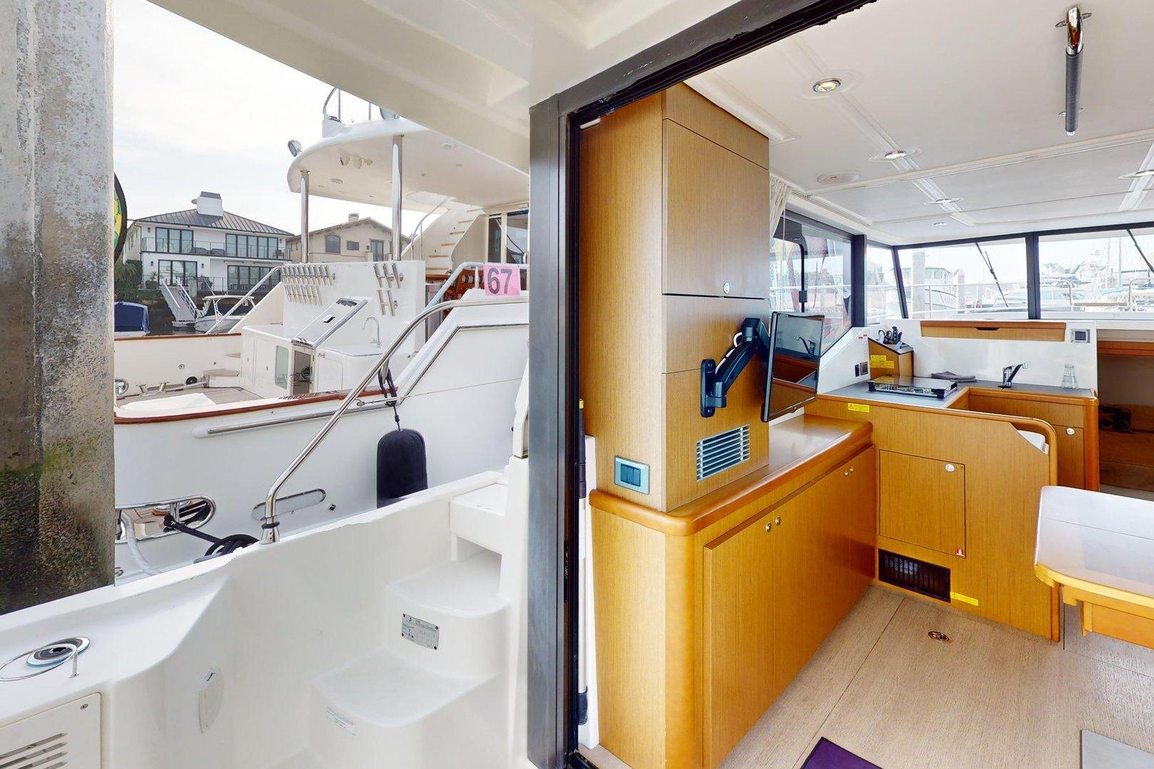 Interior view of a 2021 Beneteau Swift Trawler 35, showcasing modern wood cabinetry.