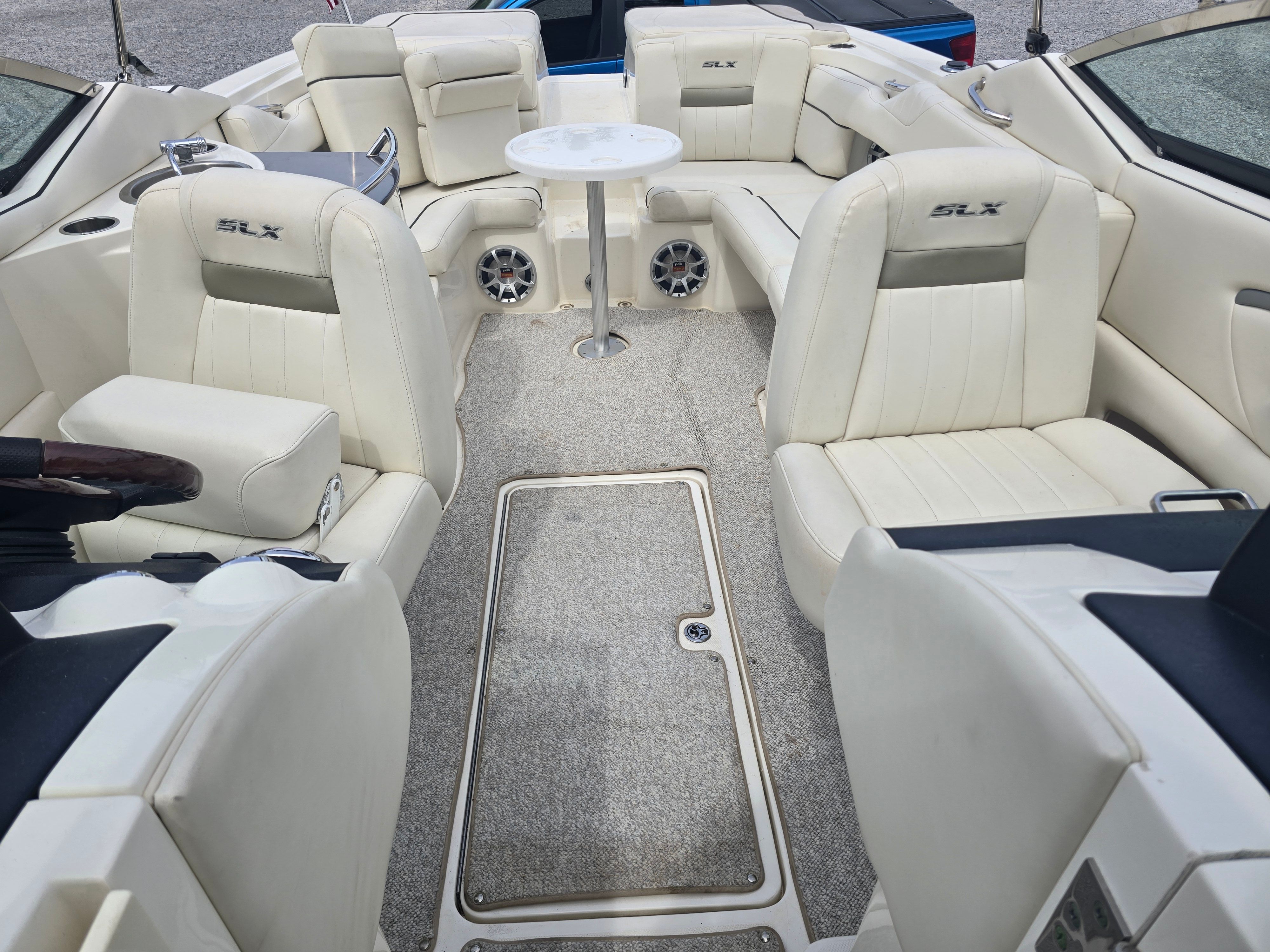 Interior of a 2007 Sea Ray 270 Select EX with white leather seating.