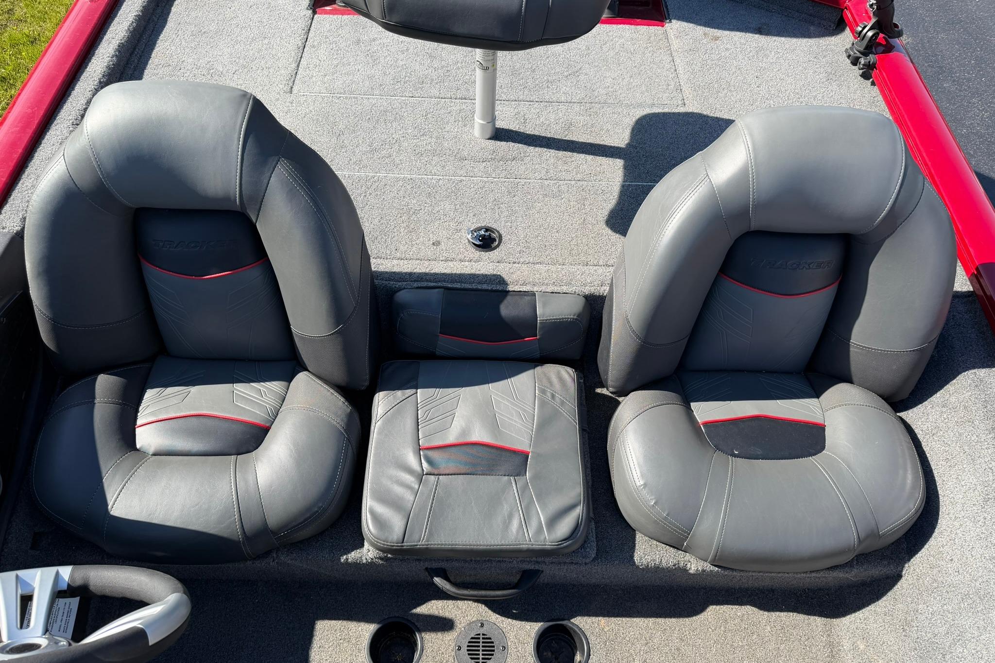 2024 Tracker Pro Team 175 TXW boat seats, featuring gray upholstery with red accents.