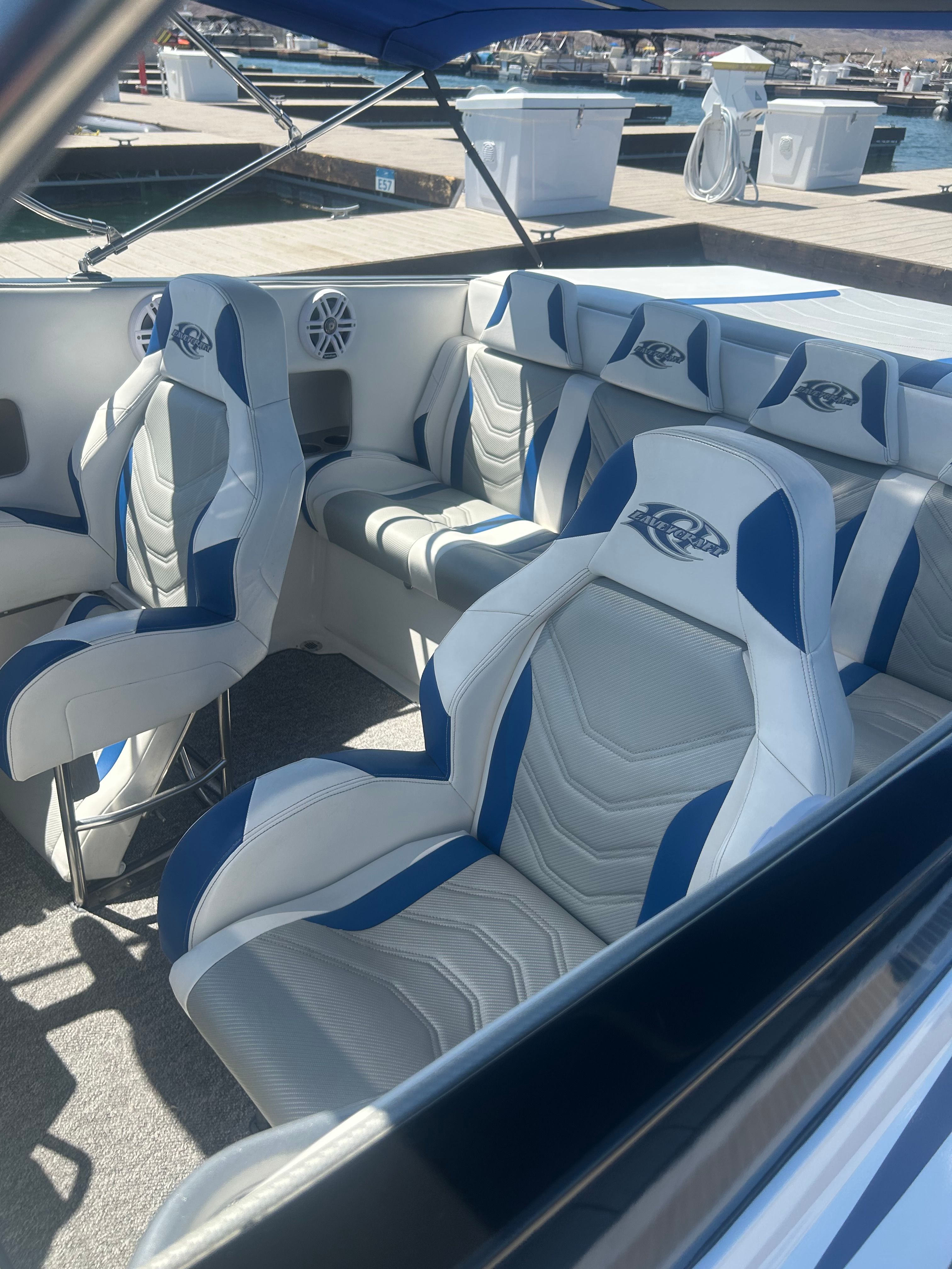 Interior of a 1999 Lavey Craft 2950 NuEra with blue and white seating.