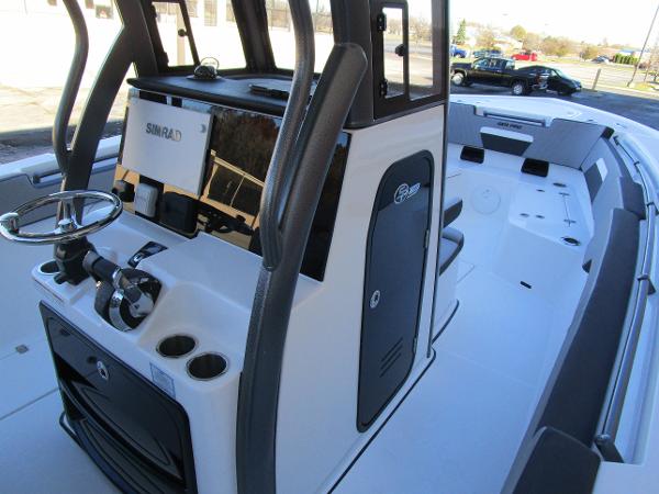 2025 Sea Pro 292 Offshore boat interior with modern controls and spacious seating.