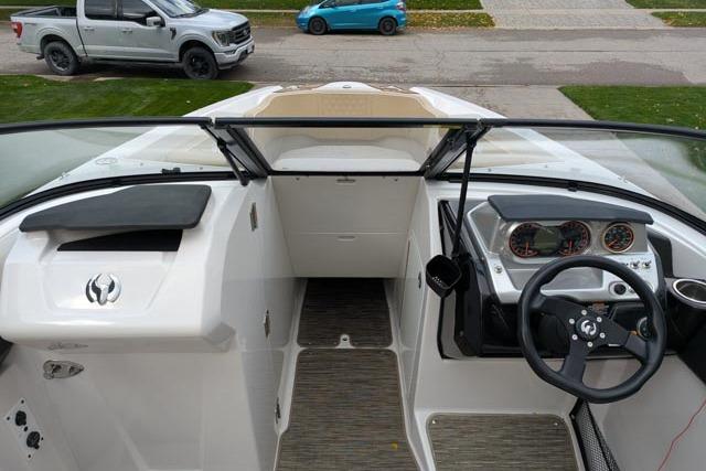 2017 Scarab 255 Platinum SE boat interior with steering wheel and dashboard view.