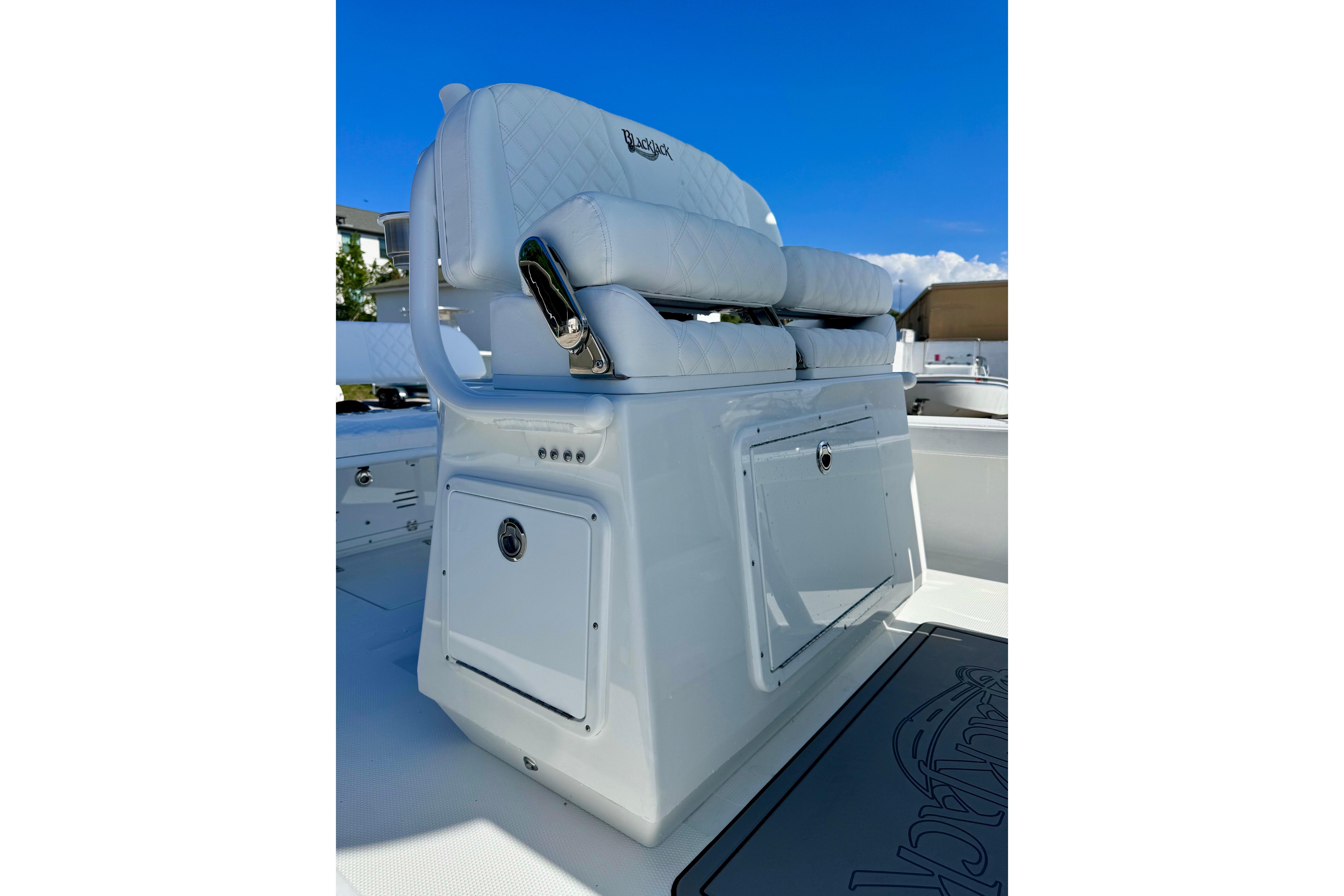 2026 BlackJack 256 Coastal boat seat with storage, featuring white upholstery and sleek design.