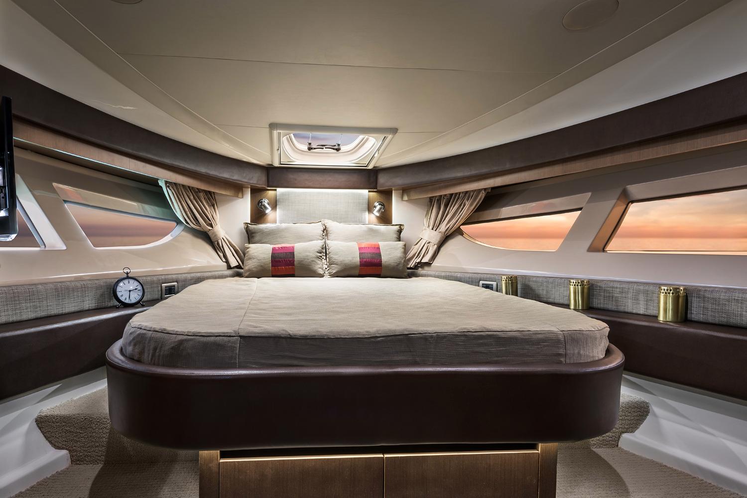 Manufacturer Provided Image: Luxurious bedroom interior of 2017 Sea Ray Sundancer 400 yacht with panoramic windows.