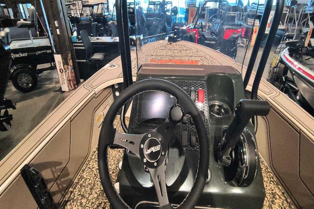 2026 Mako 18 Pro Skiff Backwater Edition boat interior with steering wheel and controls.