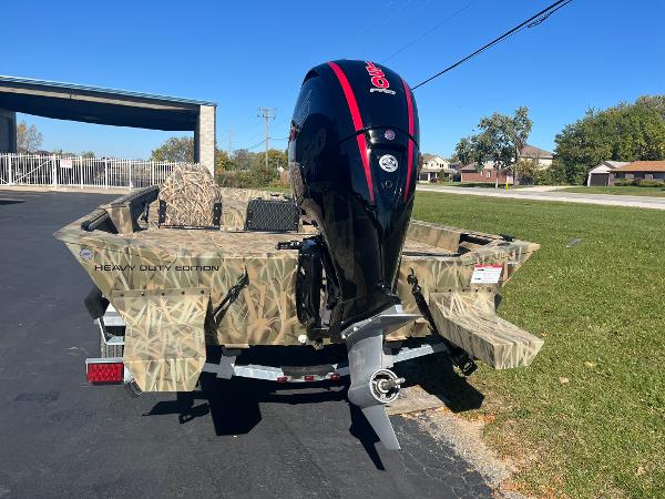 2025 Lowe Roughneck 2070 SC boat with camo design and powerful outboard motor.