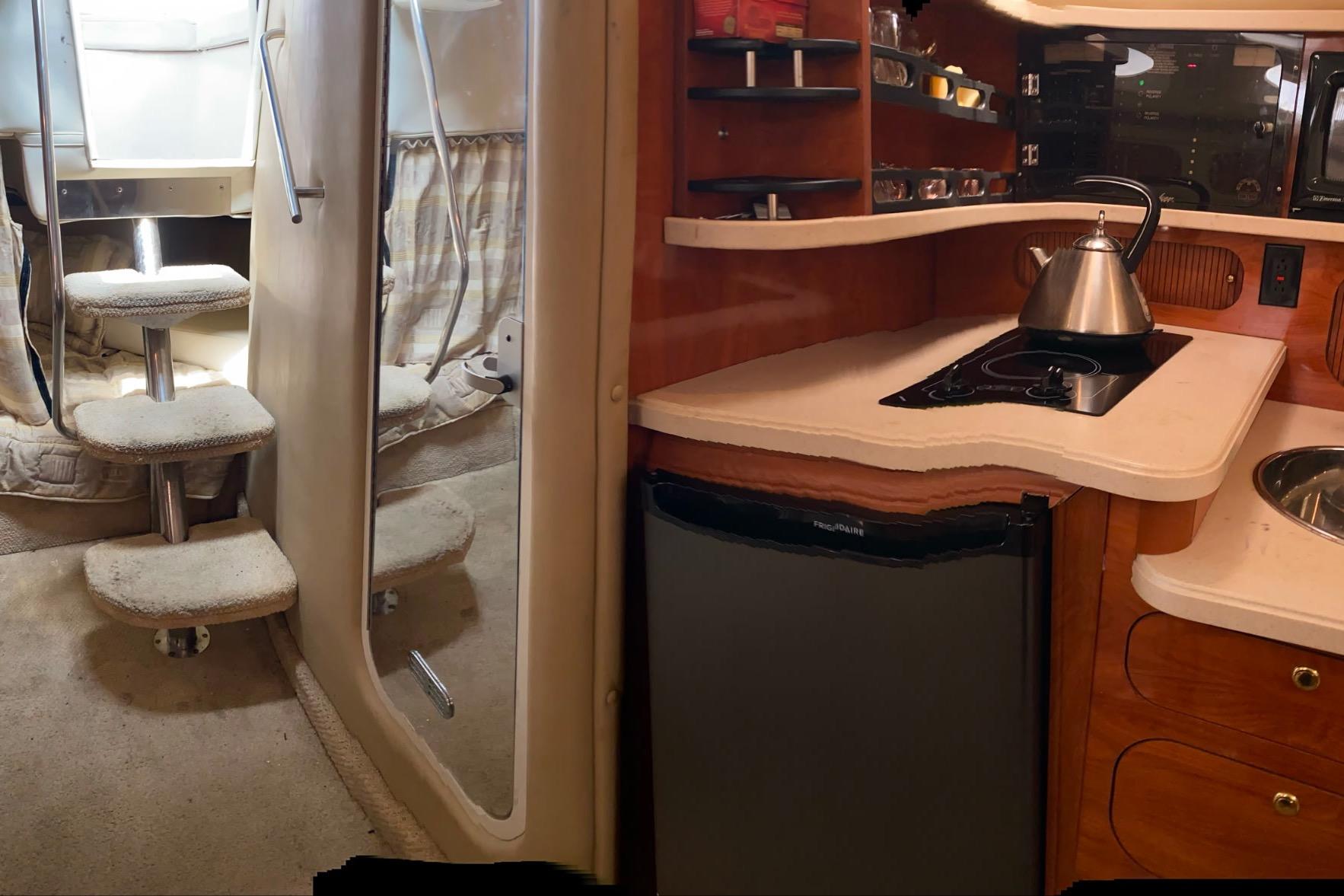 Interior of 2003 Rinker Fiesta Vee 342 yacht with kitchenette and carpeted stairs.