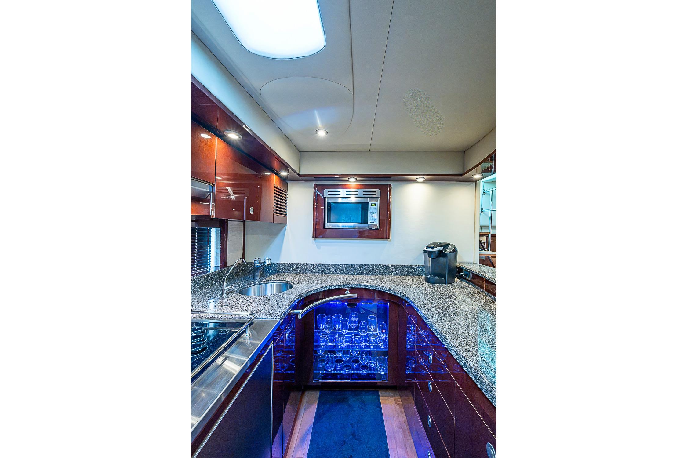 Luxurious 2008 Sea Ray 60 Sundancer yacht kitchen with modern appliances and elegant design.