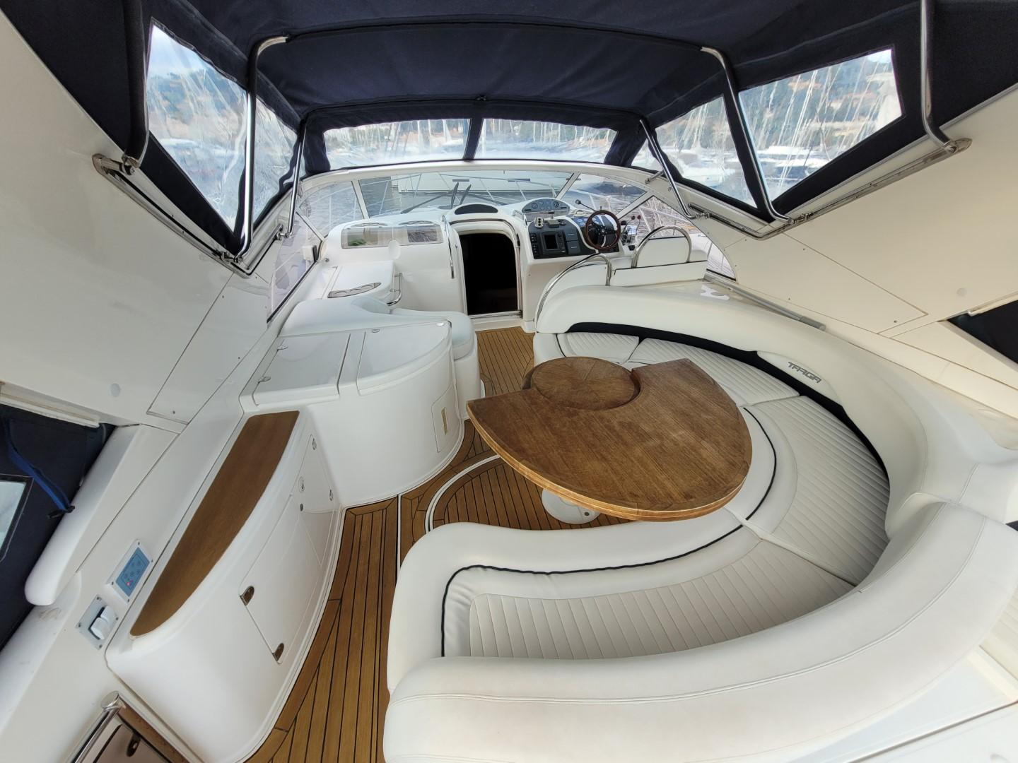 2004 Fairline Targa 43 yacht interior with white seating and wooden table.