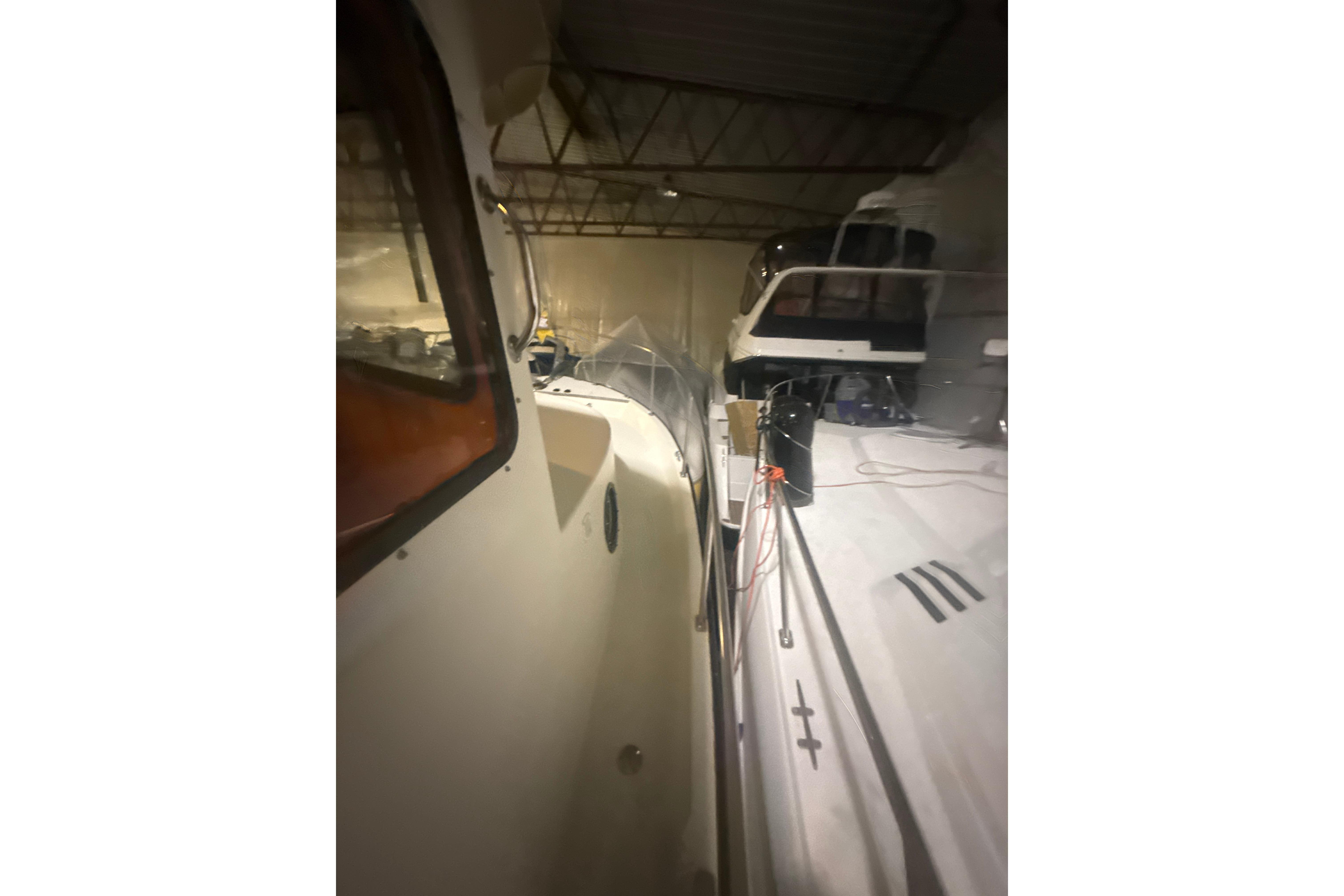 1997 Nordic Tug 42 in storage, showcasing side view and deck details.