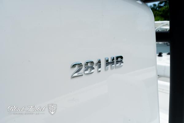 2025 Caymas 281 HB boat logo on white surface, Black Label Marine Group branding.