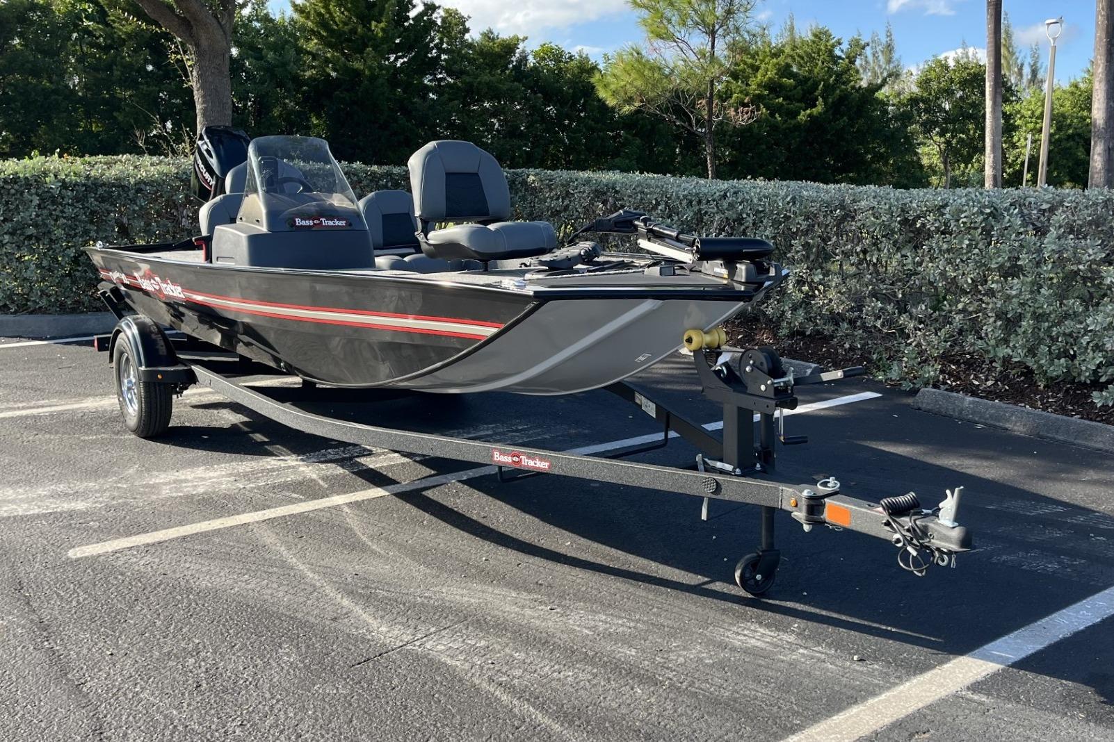 2026 Tracker Bass Tracker Classic XL boat on trailer in parking lot.