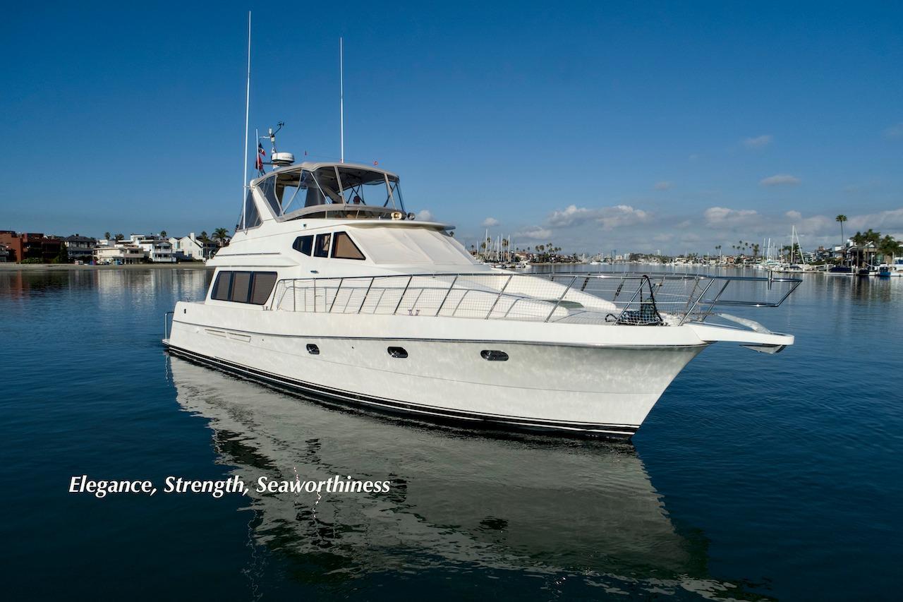 2004 McKinna 57 Pilothouse yacht on calm water, showcasing elegance and seaworthiness.