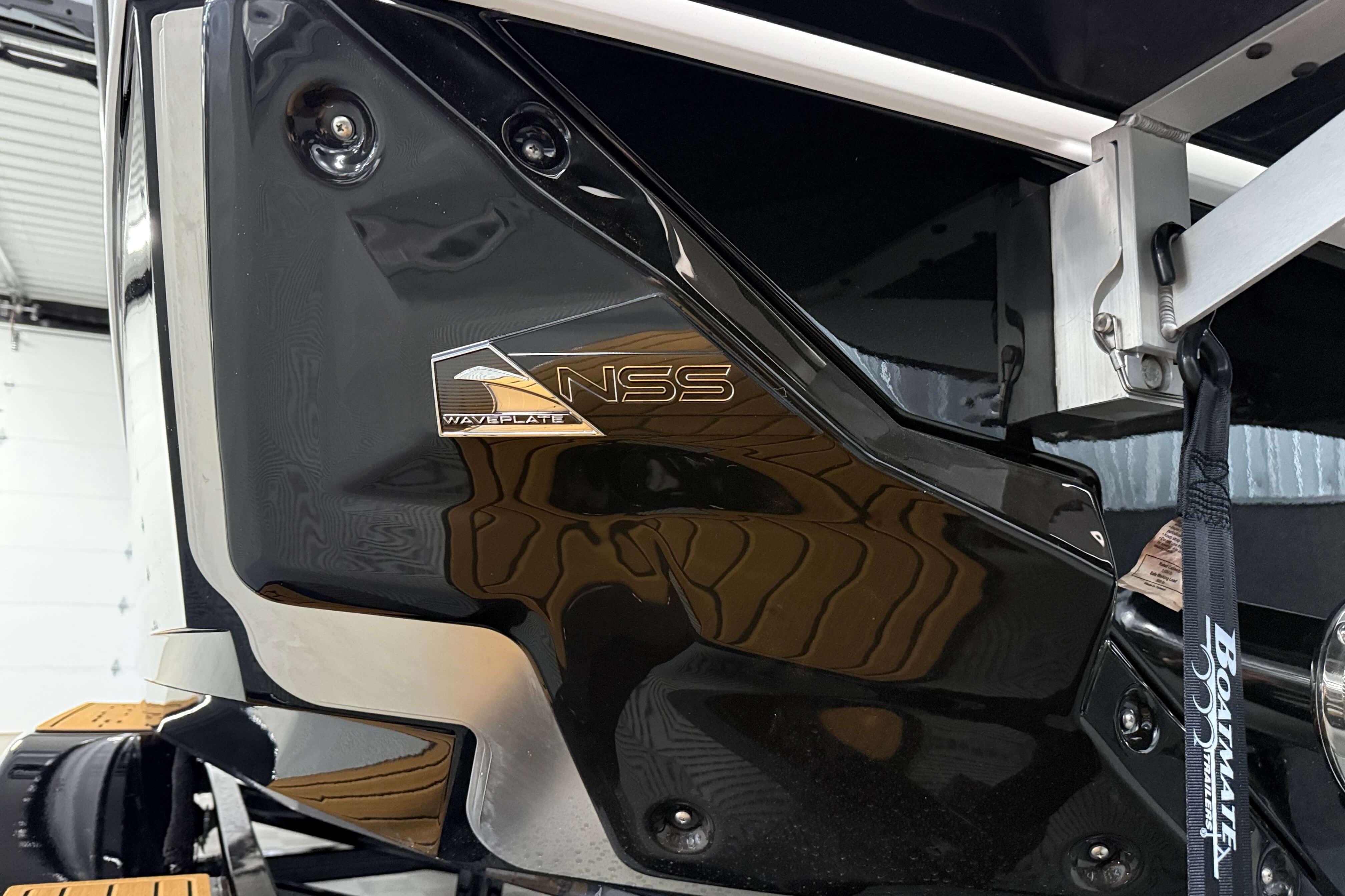 2026 Nautique Super Air Nautique S23, NSS WAVEPLATE detail, sleek black finish.