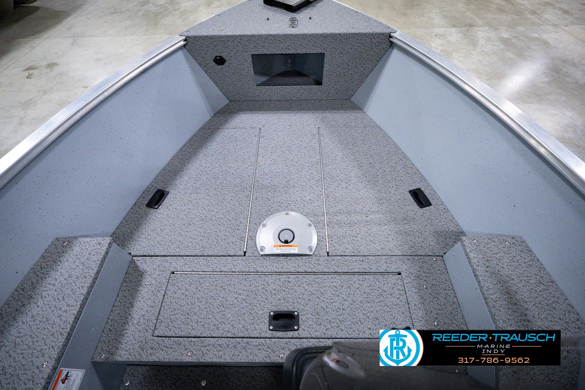 2026 Lund 1600 Fury SS boat interior with gray textured flooring.