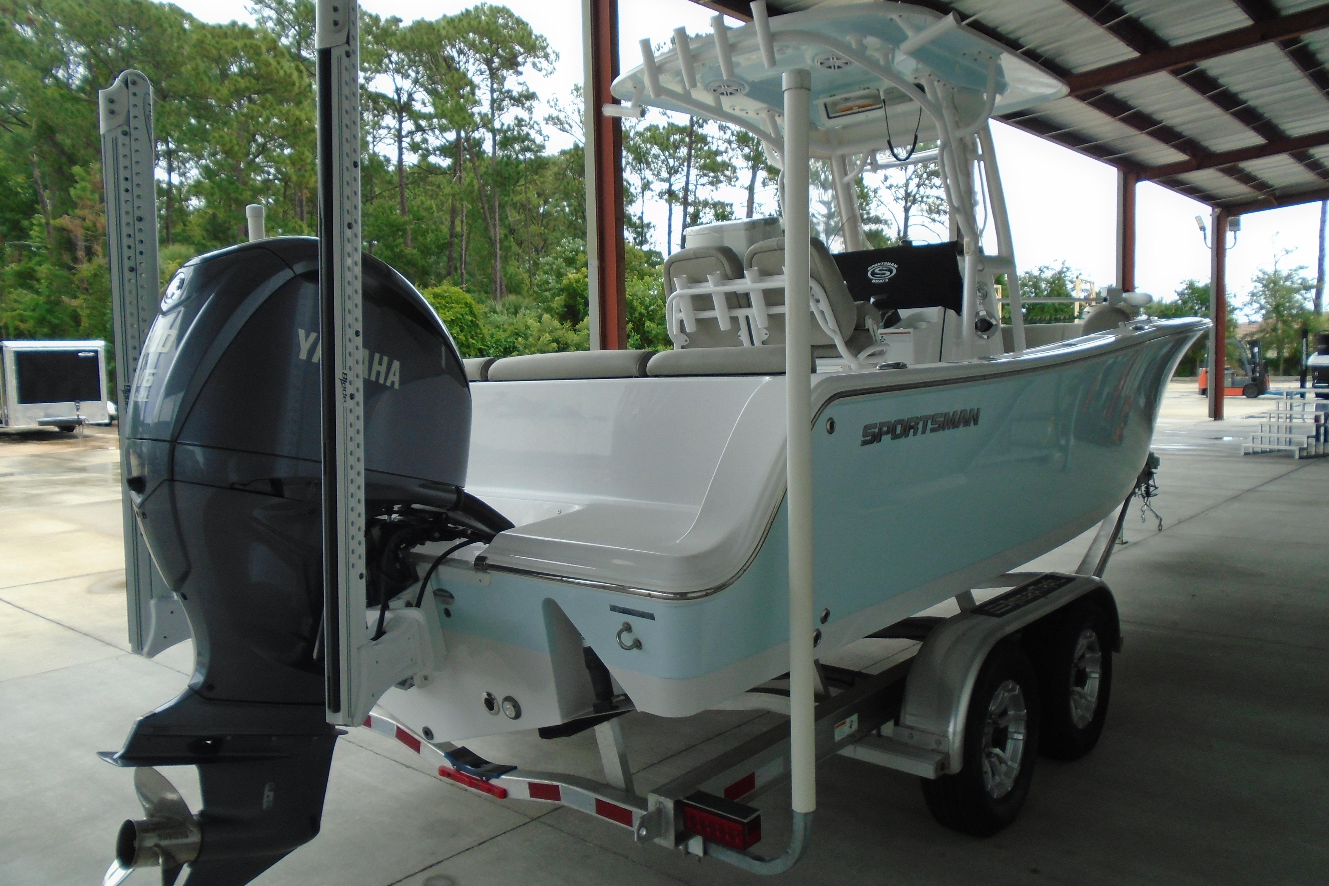 2022 Sportsman Heritage 241 Center Console boat on trailer, featuring Yamaha outboard motor.