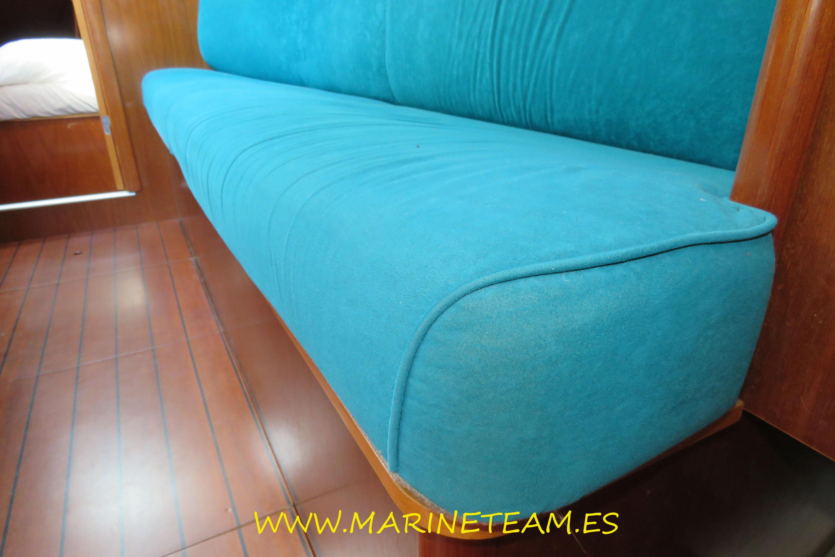 Teal sofa in 2003 Beneteau Oceanis Clipper 36 CC yacht interior.