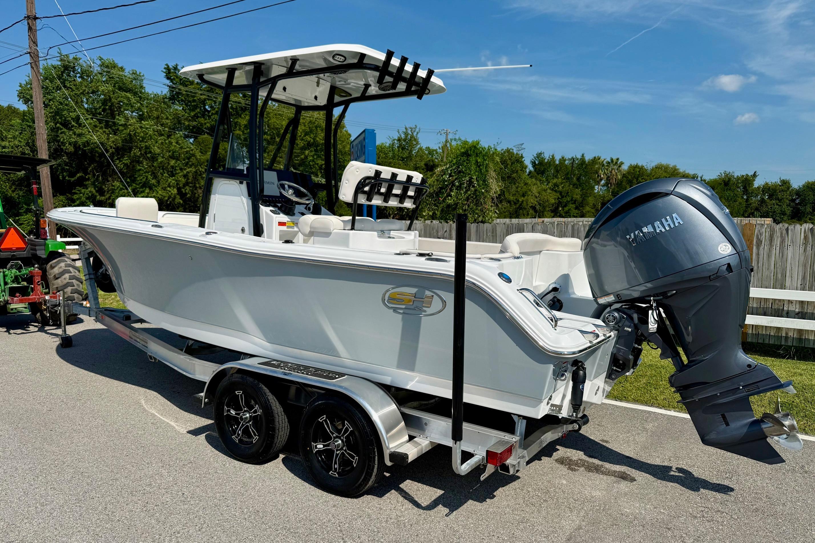 2026 Sea Hunt Ultra 229 boat on trailer with Yamaha outboard motor.