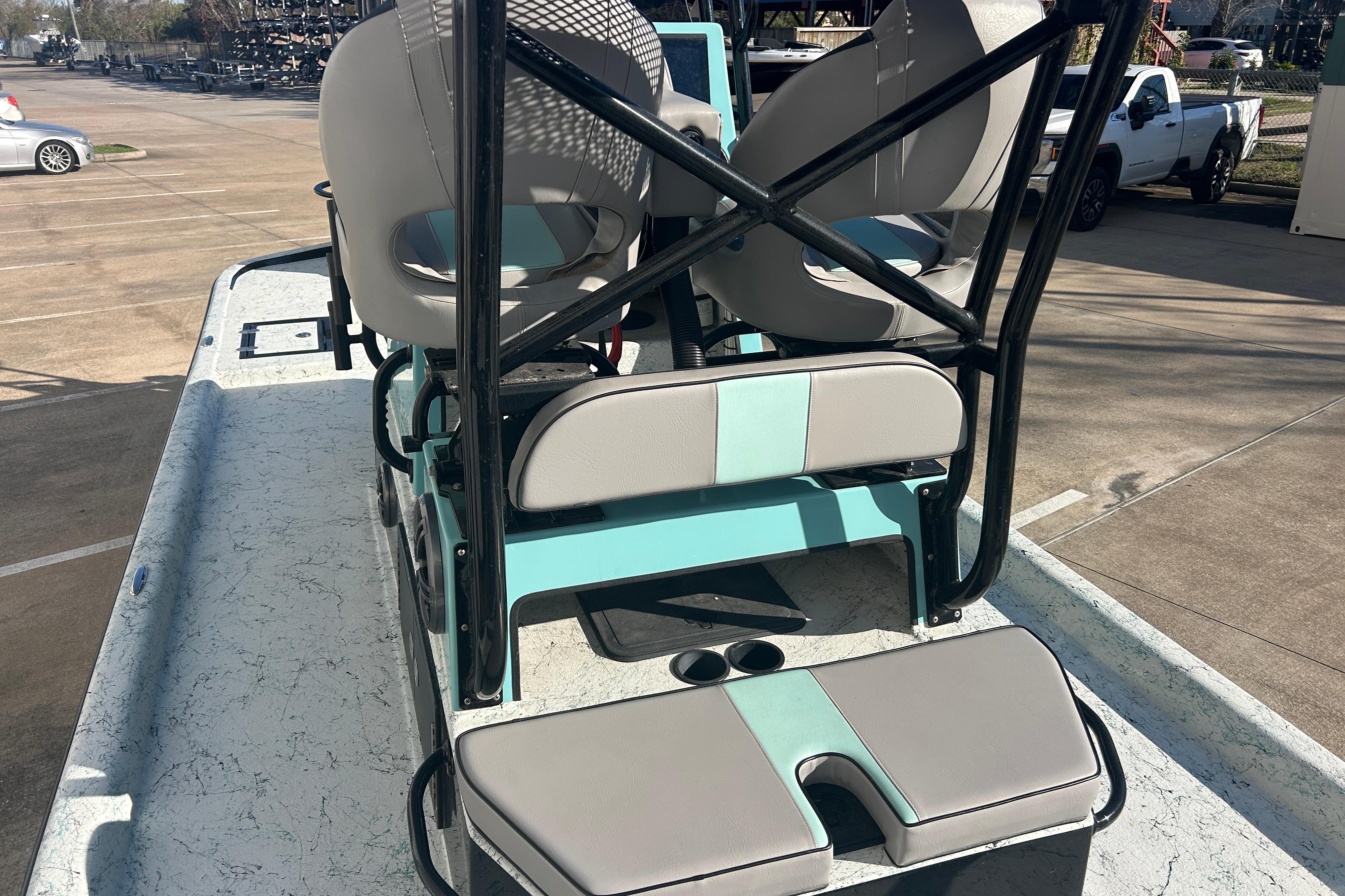 2021 Shallow Stalker Cat 240 Pro Elite boat interior with seating and cup holders.