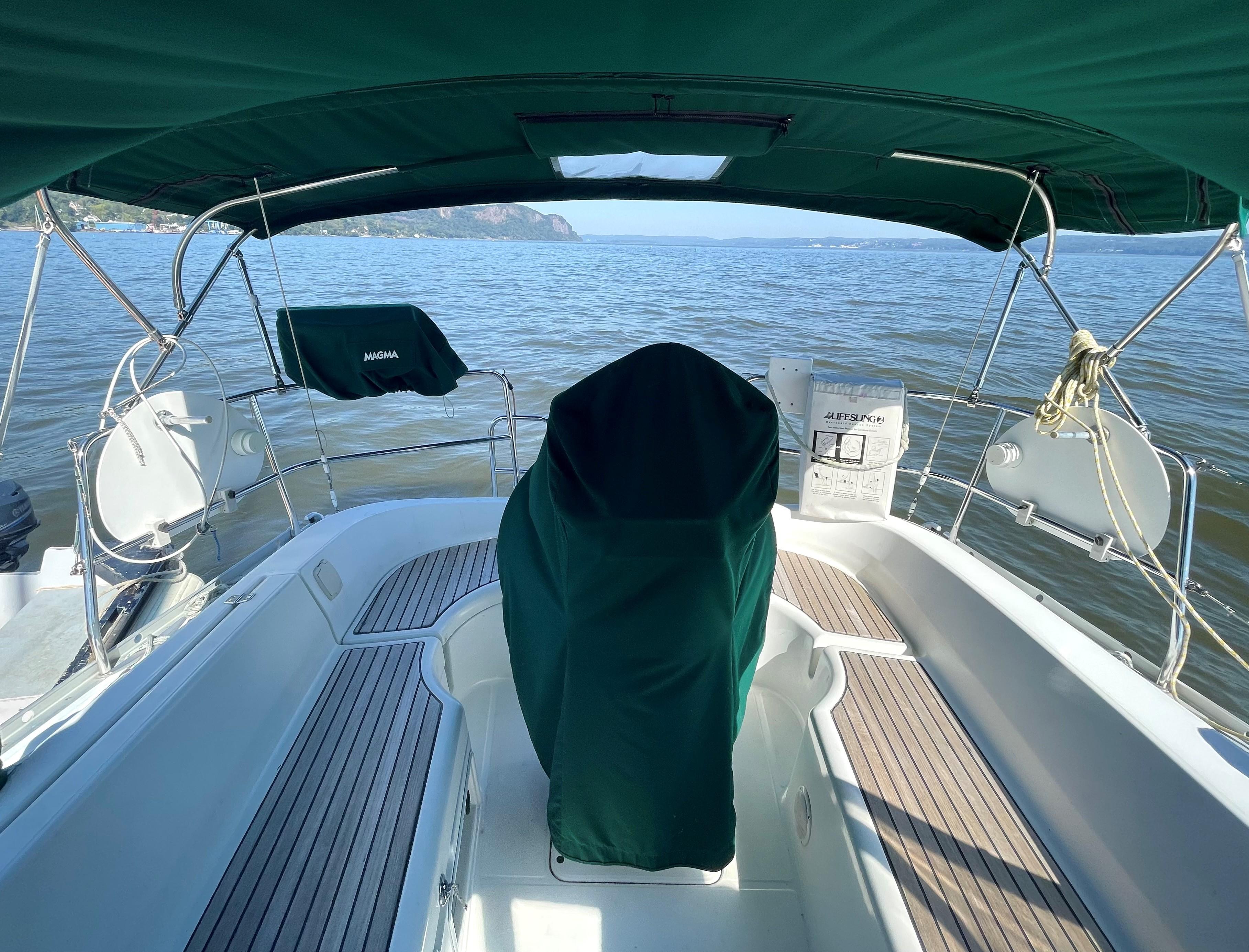 Interior view of a 2005 Beneteau 323 yacht on calm waters.