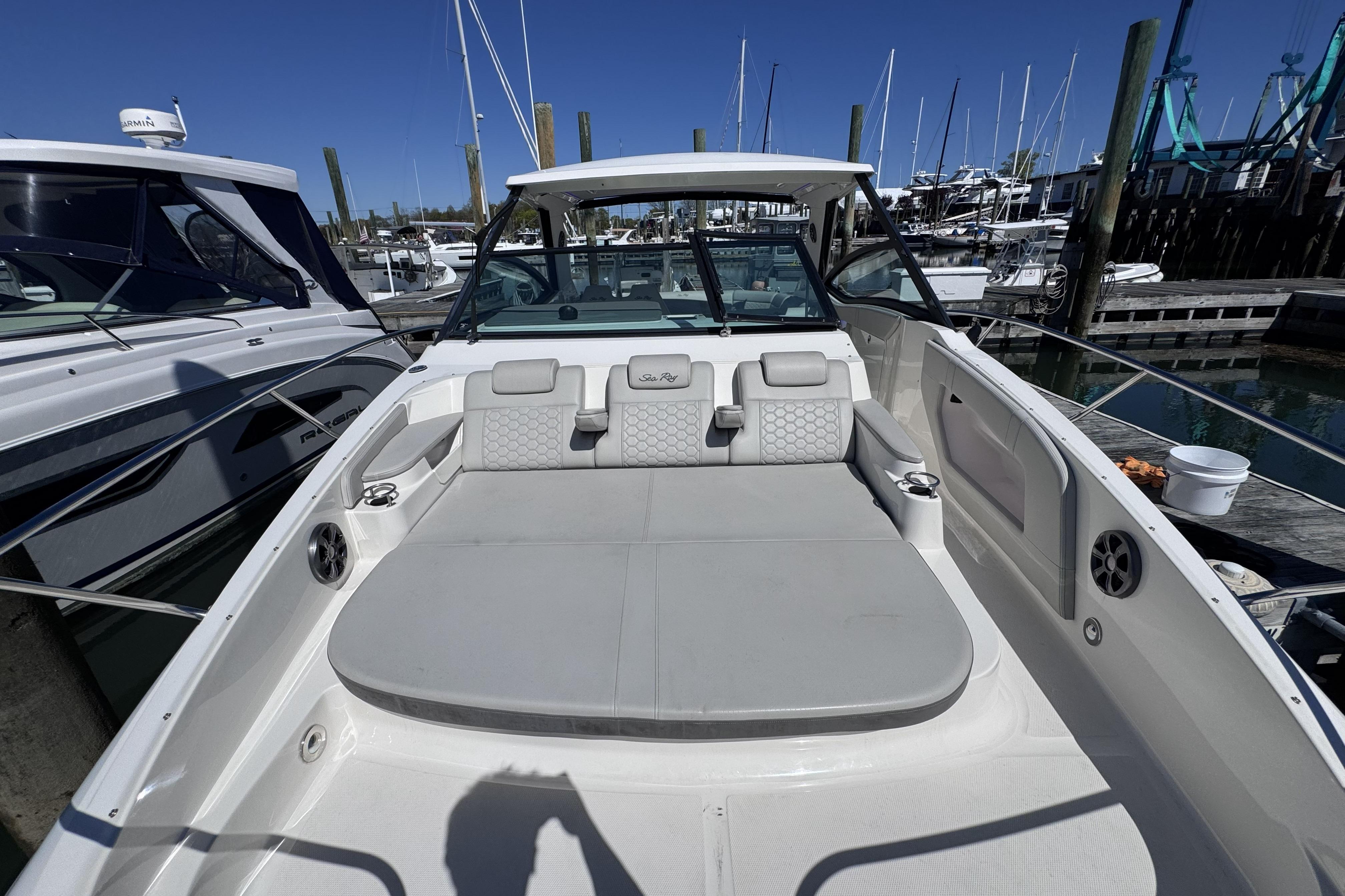 2021 Sea Ray Sundancer 320 boat docked, featuring spacious seating and modern design.