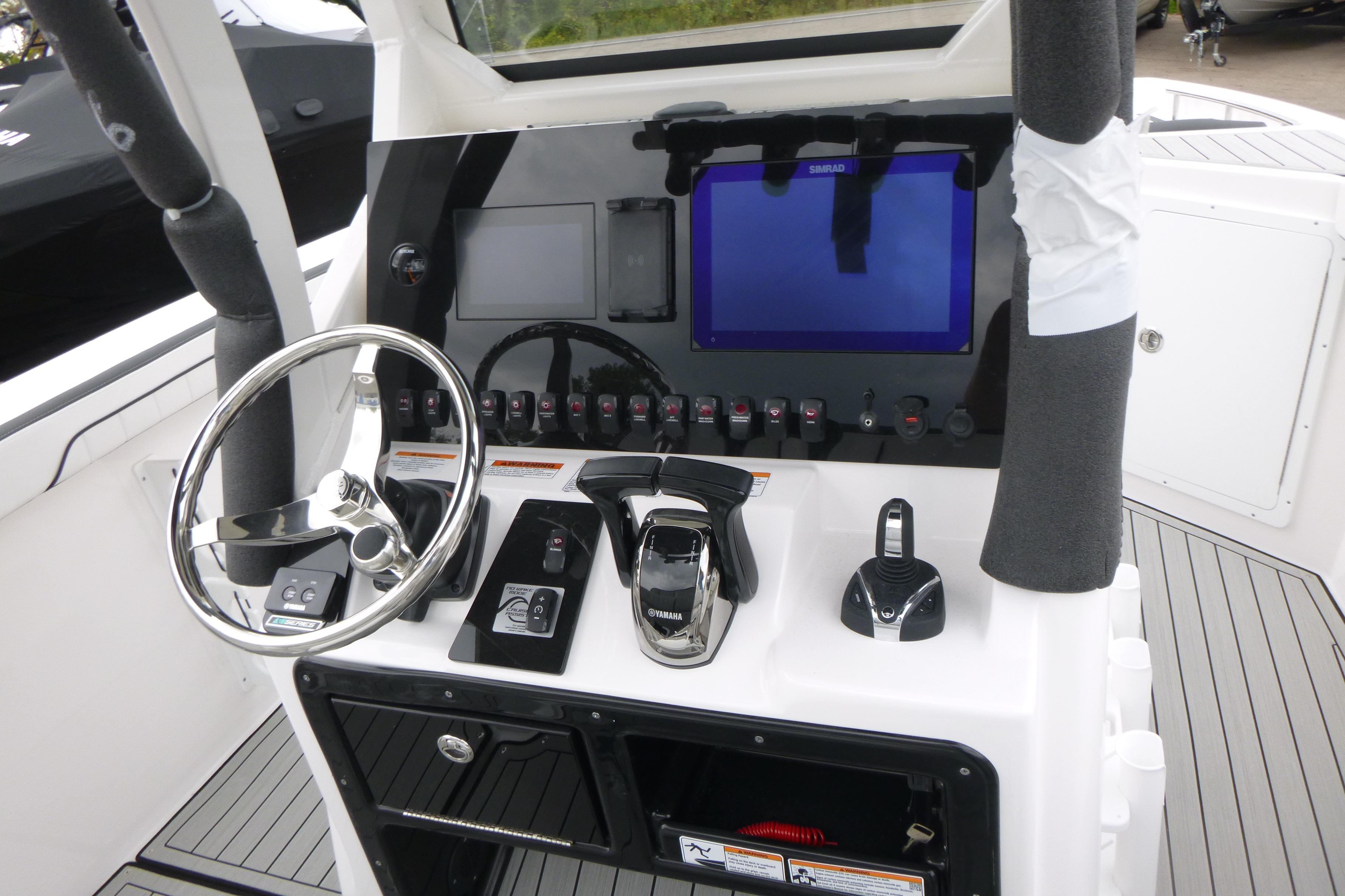 2026 Yamaha Boats 255 FSH Sport H dashboard with steering wheel and controls.