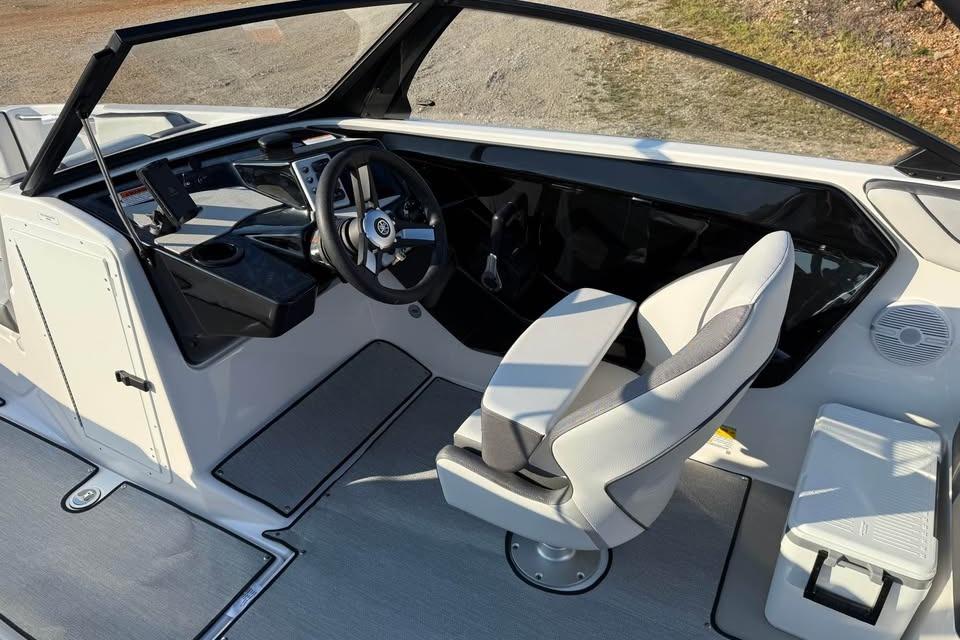 2026 Yamaha Boats AR220 cockpit with modern steering and seating design.