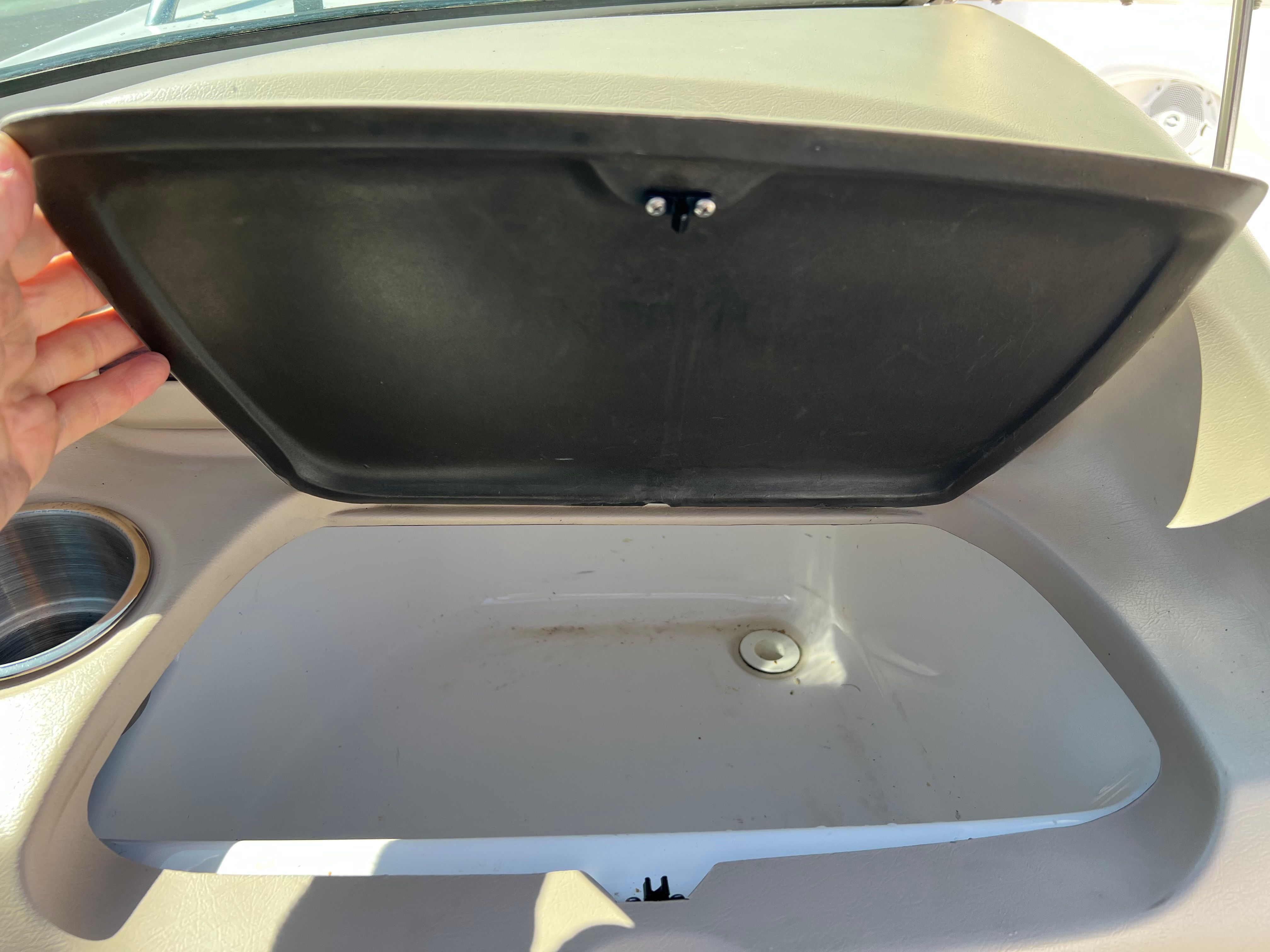 Open storage compartment in 2001 Chaparral 216 SSi boat.