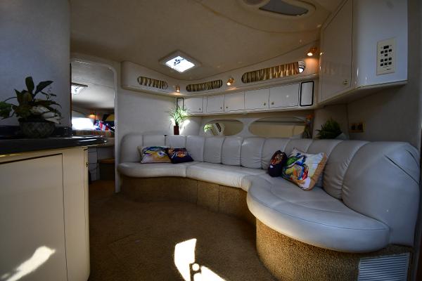 Luxurious interior of 1997 Sea Ray 400 Sundancer yacht with plush seating and elegant decor.