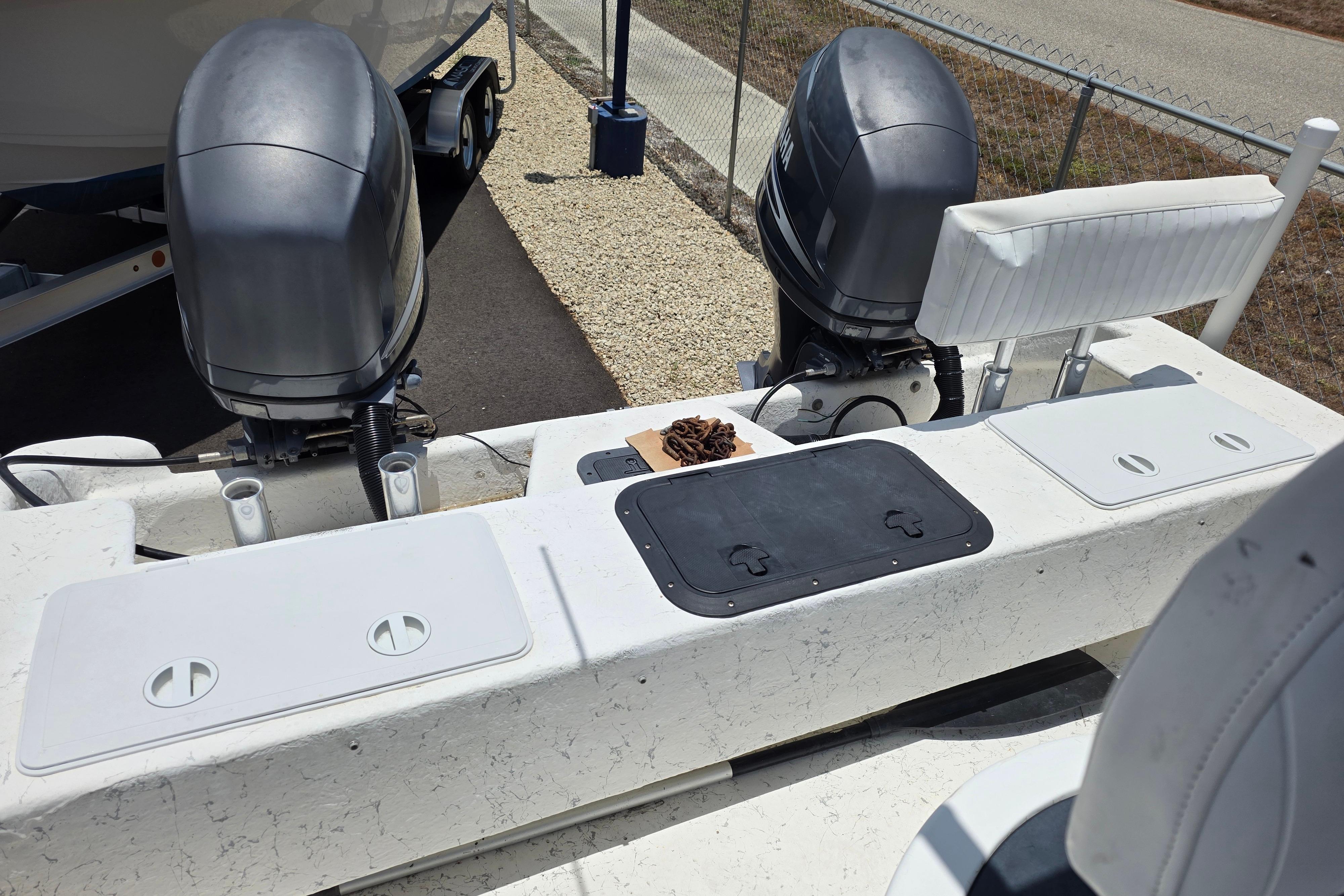 Twin Vee Awesome 22 boat, 1999 model, with dual outboard motors and seating area.