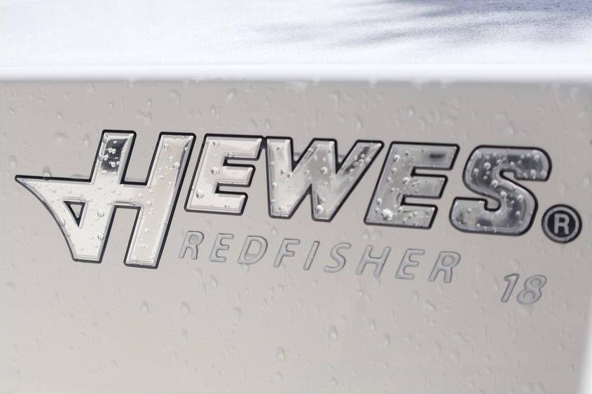 2025 Hewes Redfisher 18 logo with water droplets on surface.